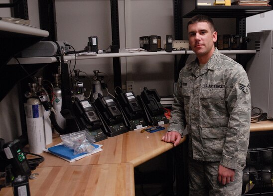 Senior Airman Rich Frank stands near test equipment March 4 at the bioenvironmental building. (U.S. Air Force photo/Staff Sgt. Dillon White)