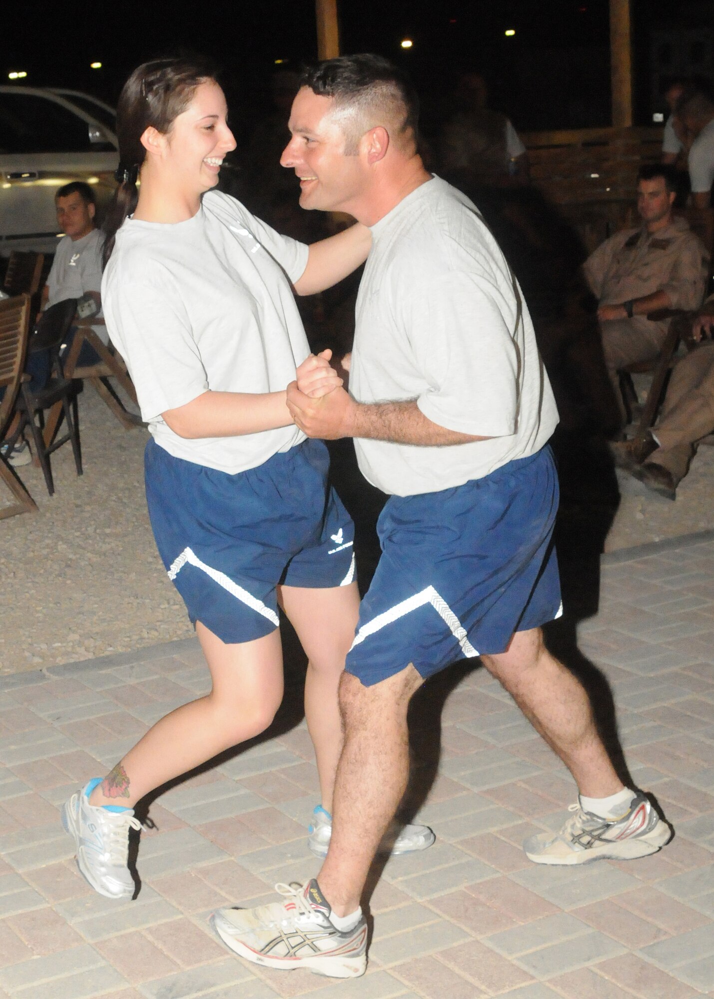 Airmen dance as the U.S. Air Forces Central Band, Wild Blue Country, performs at an undisclosed location in Southwest Asia. (U.S. Air Force photo by Master Sgt. Karl Bradley)