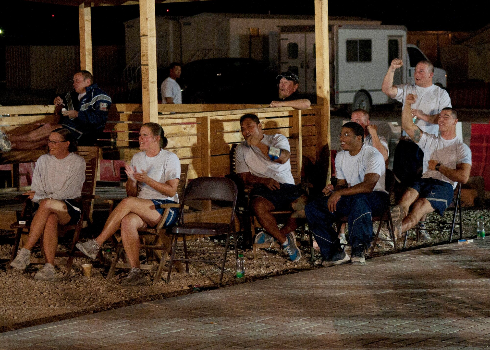 Airmen in the audience cheer as the U.S. Air Forces Central Band, Wild Blue Country, performs at an undisclosed location in Southwest Asia. (U.S. Air Force photo by Master Sgt. Karl Bradley)