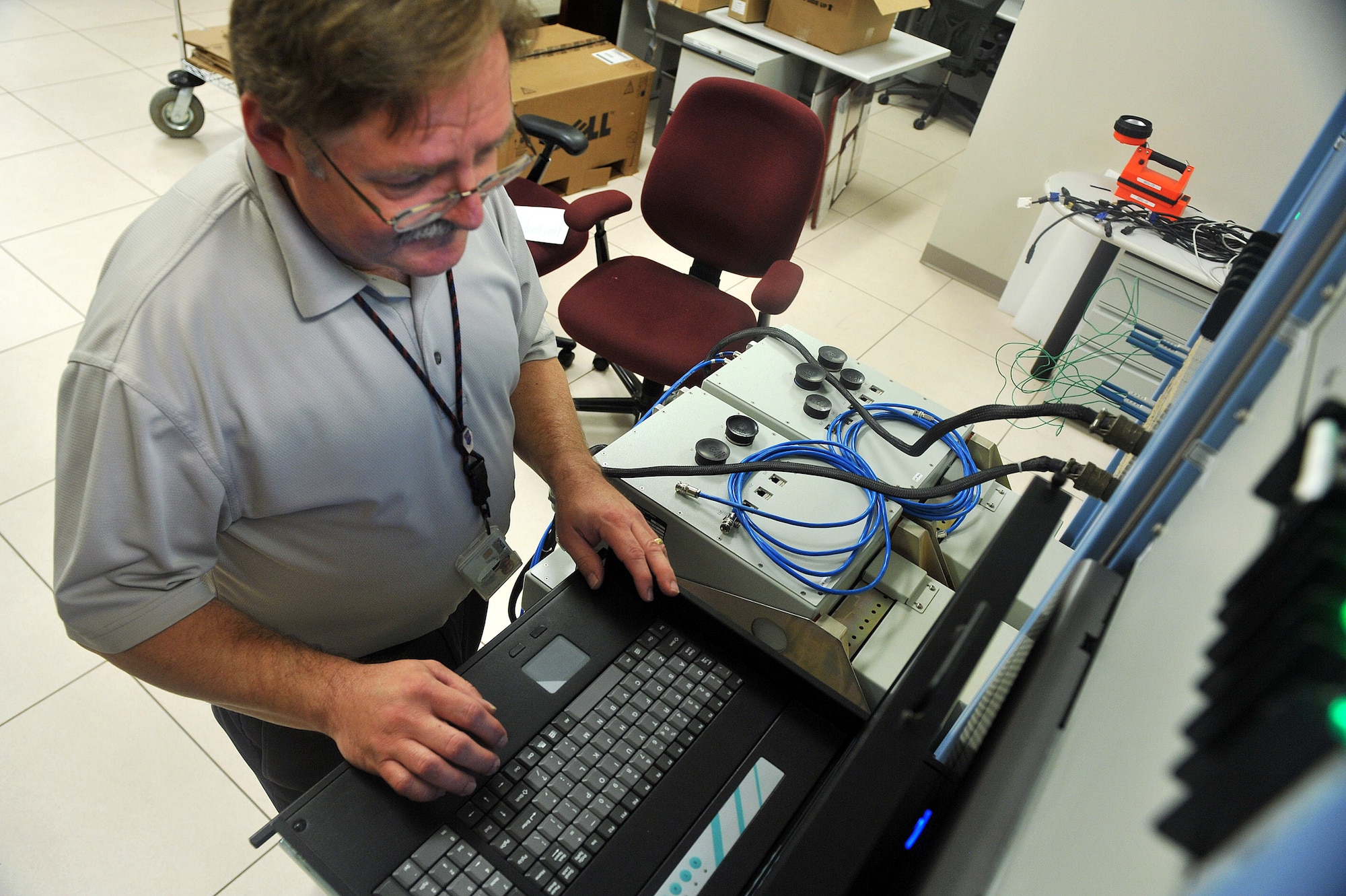 Steve Greer, 402nd Software Maintenance Group electronics engineer, performs software checks at a test station in the C-17 Aircraft Software Support section of the new facility. U.S. Air Force photo by Tommie Horton 