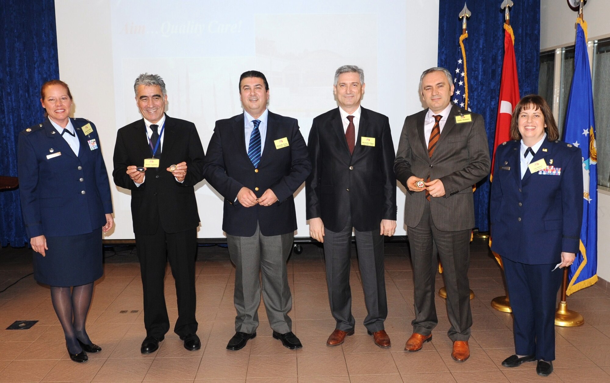 Lt. Col. Lisa Moore, the 39th Medical Support Squadron commander, and Lt. Col. Stephanie Buffett, the 39th Medical Operations Squadron commander, presented coins to Dr. Yasar Ergoren and Mustafa Turon, both from Metropark, and Dr. Mustafa Kibar and Huseyin Gelik, from Acibadem, at an open house event March 10, 2011 at Incirlik Air Base, Turkey. The open house included a tour of the facilities at Incirlik AB and provided Medical Group personnel the opportunity to interact with their fellow host-nation physicians, officials said.  (U.S. Air Force photo by Airman 1st Class Clayton Lenhardt/Released)