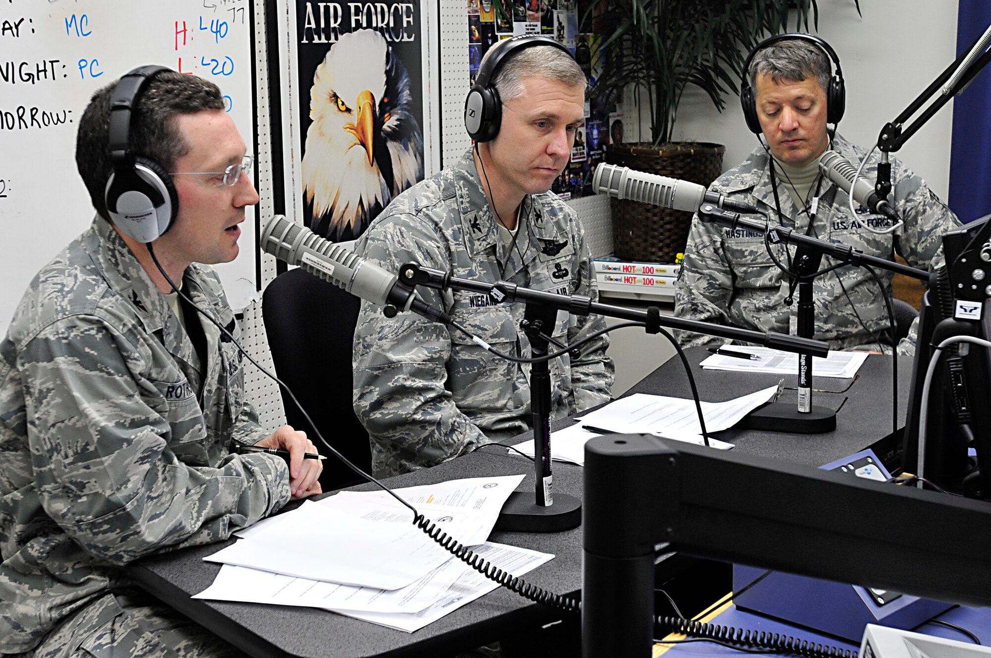 MISAWA AIR BASE, Japan -- Col. Michael Rothstein, 35th Fighter Wing commander, left, and David Wiegand, 35th Mission Support Group commander, center, along with Chief Master Sgt. Russell Hastings, 35th FW command chief, addresses questions through the Armed Forces Network Mar. 18. The commander's open line is a way for military members and their dependents to address the wing commander on issues relating to the base and military life. (U.S. Air Force photo by Staff Sgt. Marie Brown\Released)