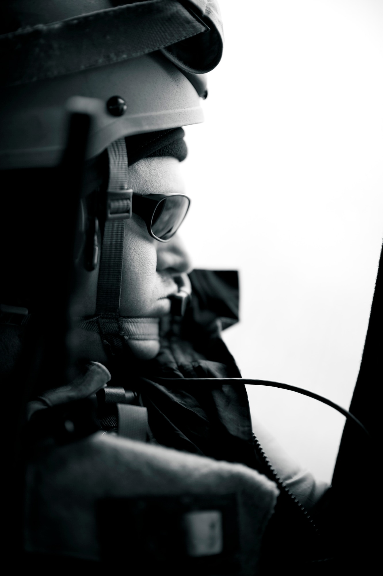 YOKOTA AIR BASE, Japan -- A pararescueman from the 320th Special Tactics Squadron from Kadena Air Base, Japan, looks out the window of an HH-60G Pave Hawk flying over the Japanese countryside March 15. The 320th STS has combat controllers, pararescuemen and special operations weather teams to go anywhere and set up forward operating locations and impromptu runways. (U.S. Air Force photo/Staff Sgt. Samuel Morse)