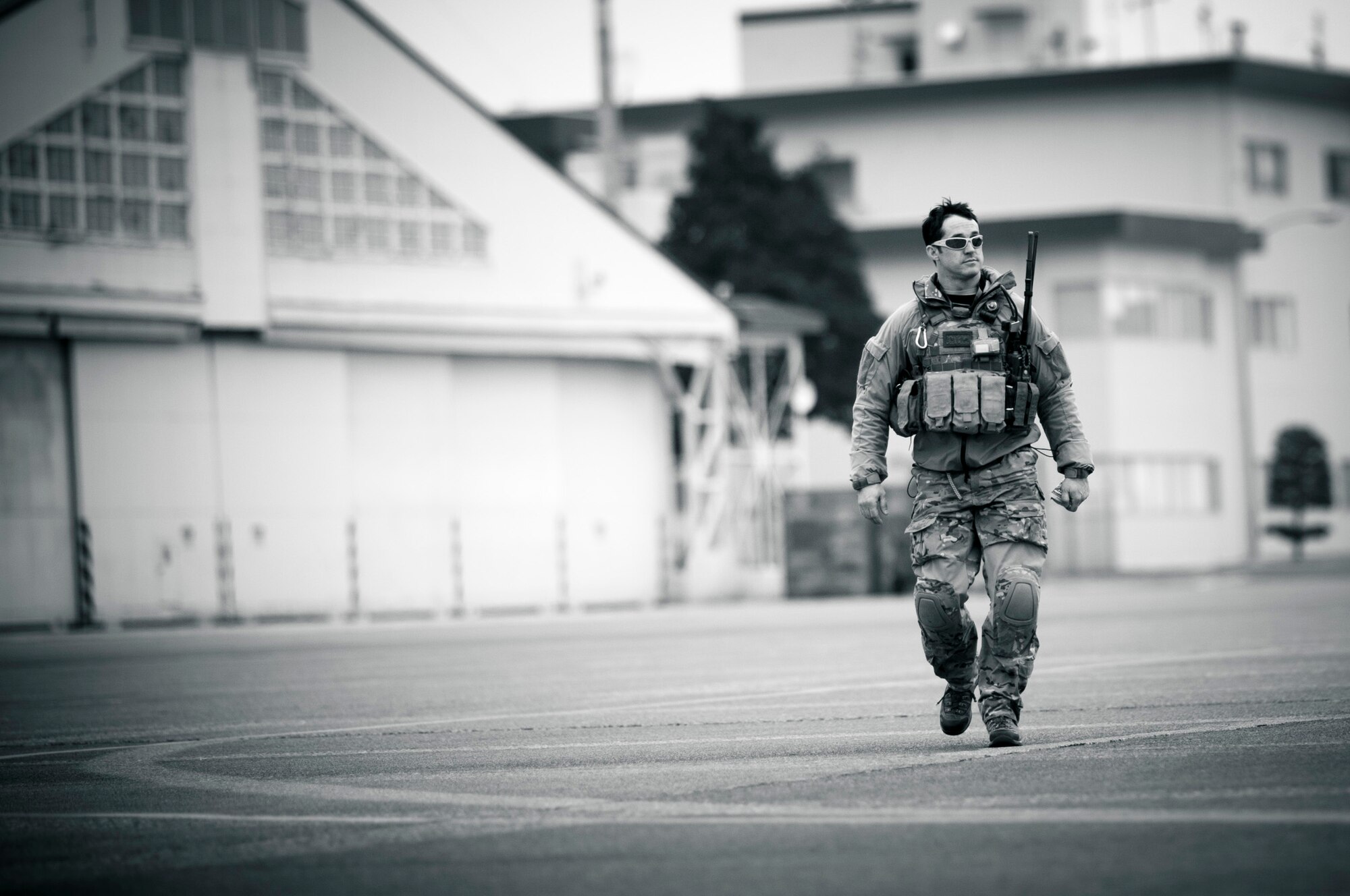YOKOTA AIR BASE, Japan -- A member of the 320th Special Tactics Squadron from Kadena Air Base, Japan, walks across the flightline to board an HH-60G Pave Hawk here March 15. The 320th STS has combat controllers, pararescuemen and special operations weather teams to go anywhere and set up forward operating locations and impromptu runways. (U.S. Air Force photo/Staff Sgt. Samuel Morse)