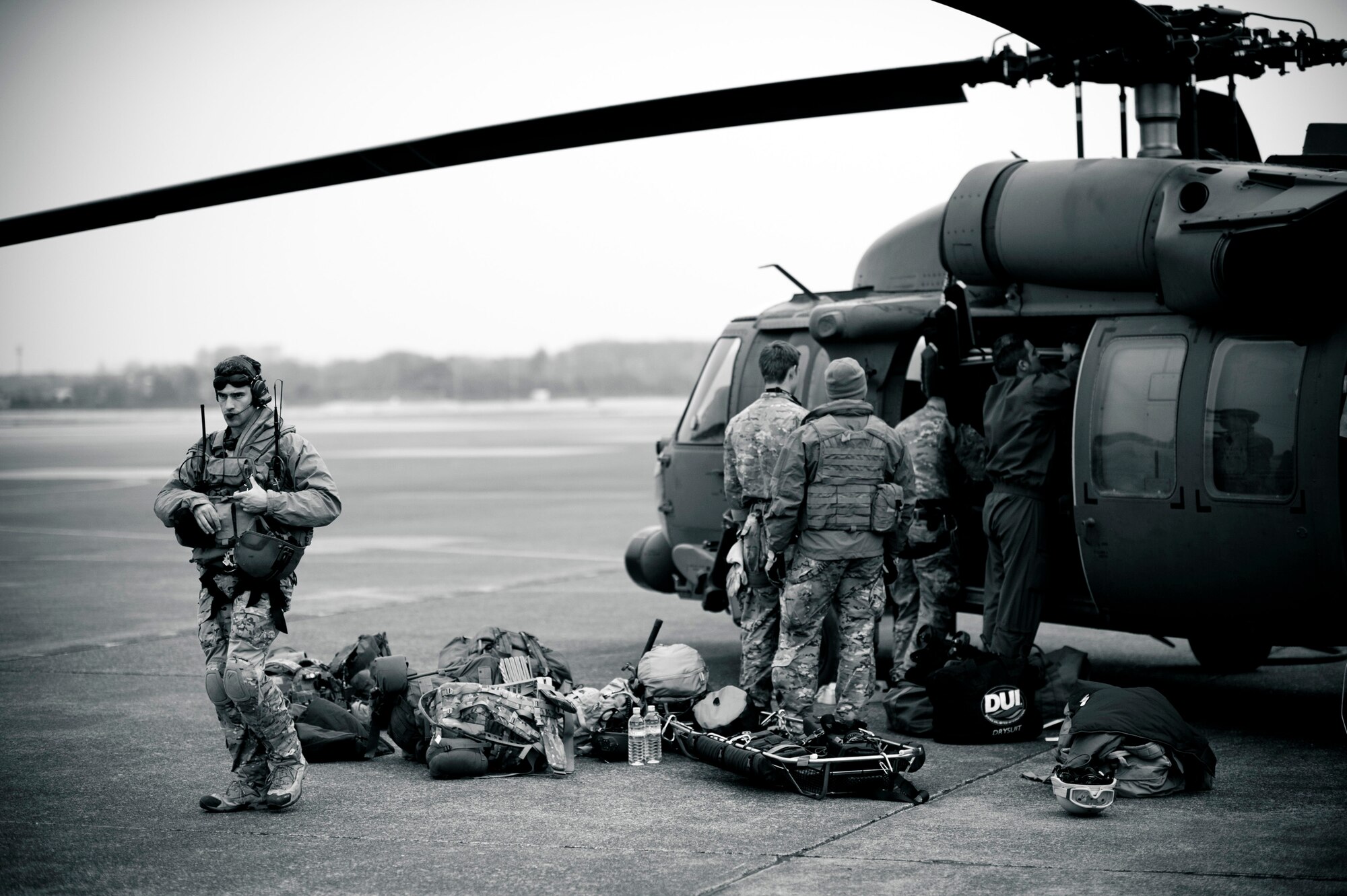 YOKOTA AIR BASE, Japan -- Members of the 320th Special Tactics Squadron from Kadena Air Base, Japan, load an HH-60G Pave Hawk here March 15. The 320th STS has combat controllers, pararescuemen and special operations weather teams to go anywhere and set up forward operating locations and impromptu runways. (U.S. Air Force photo/Staff Sgt. Samuel Morse)