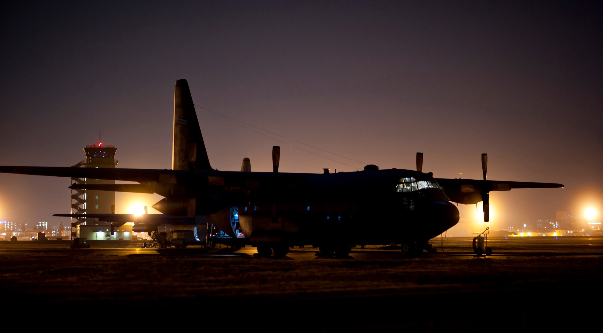 YOKOTA AIR BASE, Japan -- Maintainers from the 374th Aircraft Maintenance Squadron power up a C-130 Hercules for nighttime flying operations here March 14. C-130s play a crucial role in disaster relief due to their ability to land on dirt runways and other less-than-ideal landing conditions. (U.S. Air Force photo/Staff Sgt. Samuel Morse)