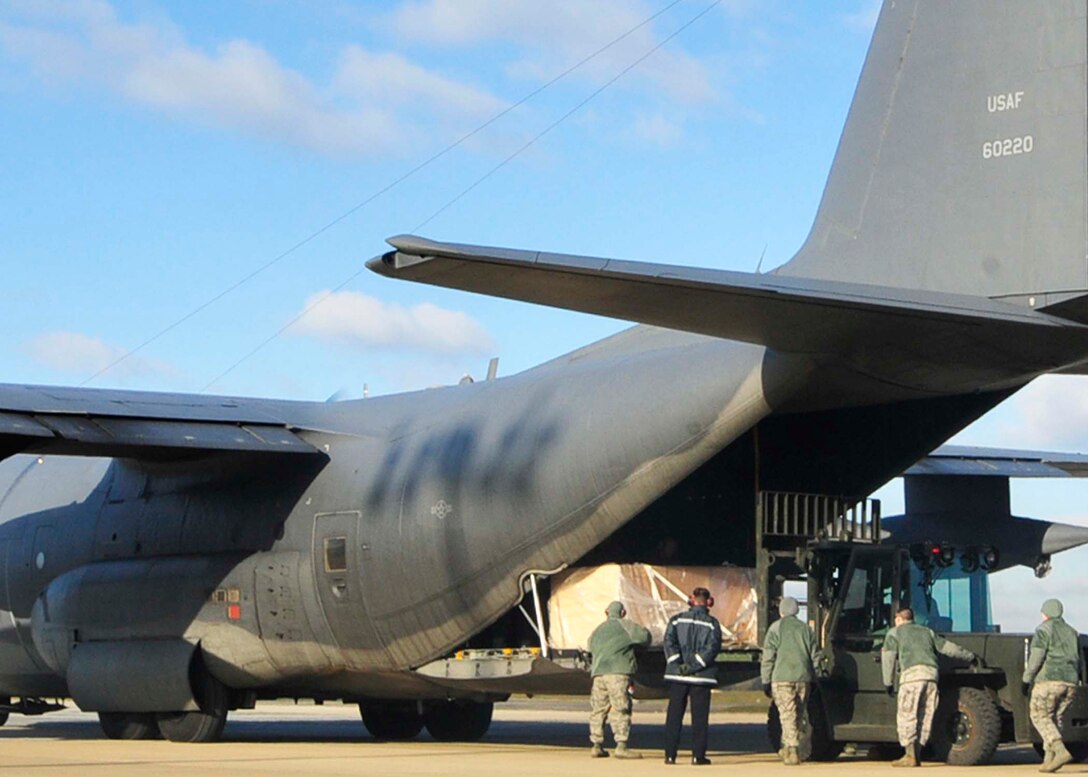 ROYAL AIR FORCE LAKENHEATH, England -- 48th Fighter Wing Airmen unload a crate from a C-130 Hercules on the RAF Lakenheath flightline on Jan. 28. The C-130 arrived from Aviano Air Base, Italy, carrying the canopy of a Serbian MiG-29. The MiG-29 was shot down by an F-15C Eagle pilot from the 493rd Fighter Squadron during Operation Allied Force. (U.S. Air Force photo/Senior Airman Tiffany M. Deuel)
