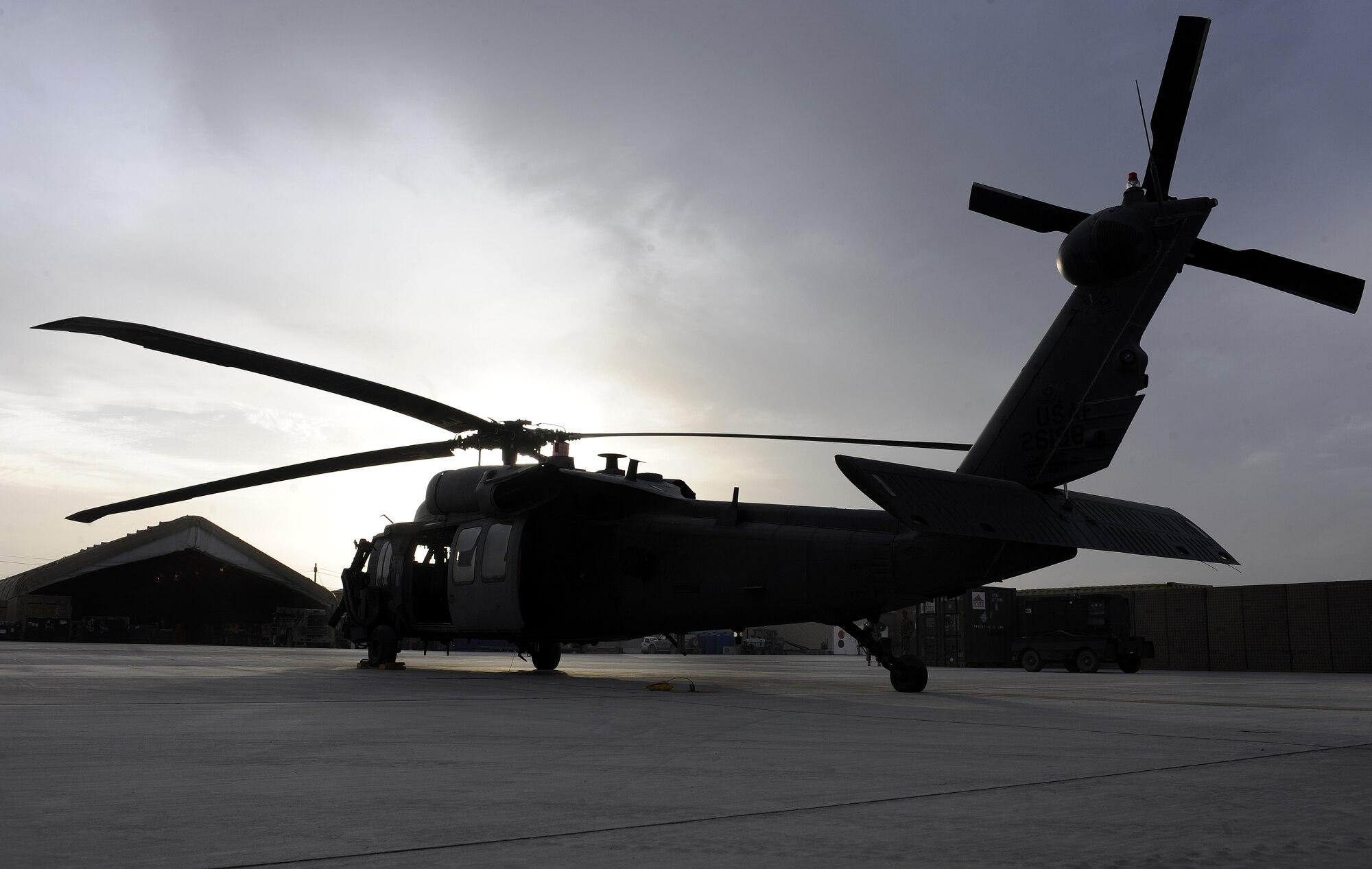 An HH-60 Pave Hawk sits idle on the ramp March 17, 2011, at Kandahar Airfield, Afghanistan. The 26th Expeditionary Rescue Squadron provides search and rescue support throughout southern Afghanistan. (U.S. Air Force photo/Senior Airman Willard E. Grande II)
