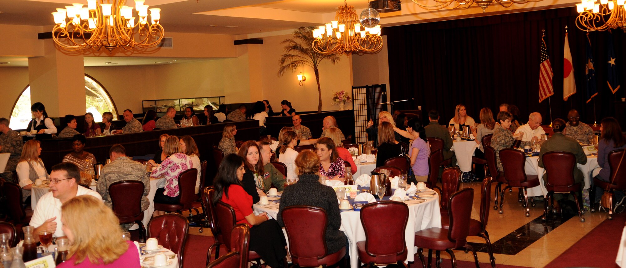 Spouses and servicemembers gather at the Kadena Officer’s Club for the Key Spouse Appreciation Luncheon, at Kadena Air Base, March 18. The Key Spouses Association is a network of people and support for spouses of servicemembers, particularly during deployments. (U.S. Air Force photo/Airman 1st Class Jarvie Z. Wallace)