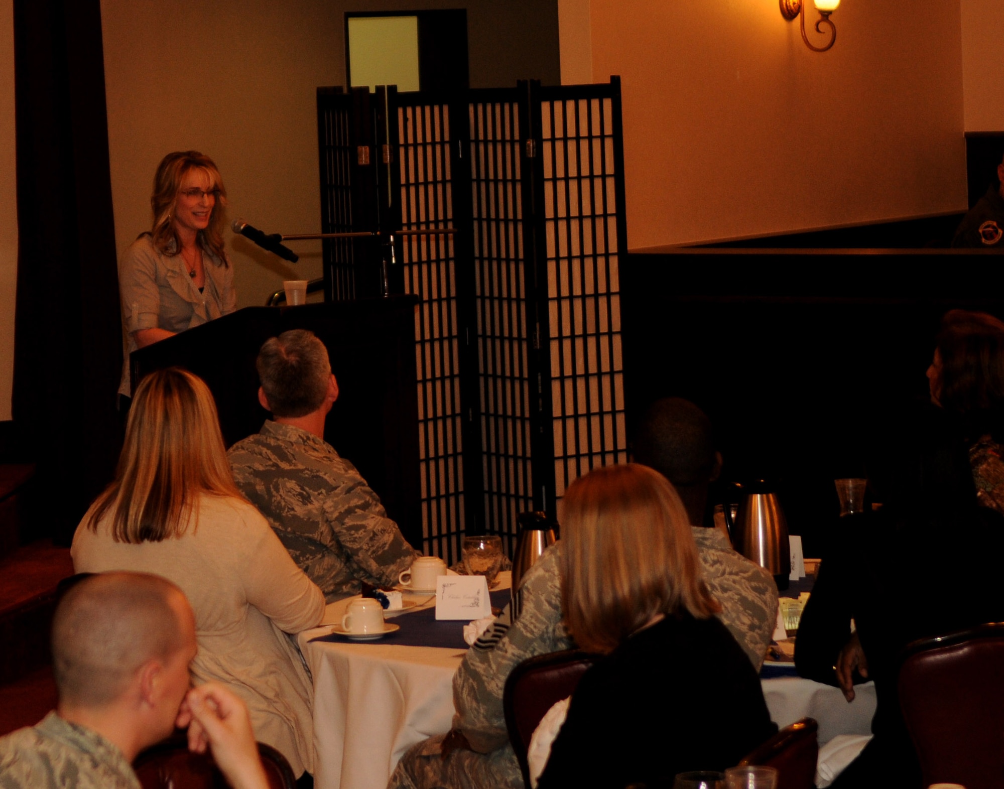 Cindy Wilsbach, wife of Brig. Gen. Ken Wilsbach, 18th Wing commander, gives a speech at the Key Spouse Appreciation Luncheon, at Kadena Air Base, March 18. The luncheon was hosted in honor of the hard work and sacrifices made by the spouses of servicemembers. (U.S. Air Force photo/Airman 1st Class Jarvie Z. Wallace)