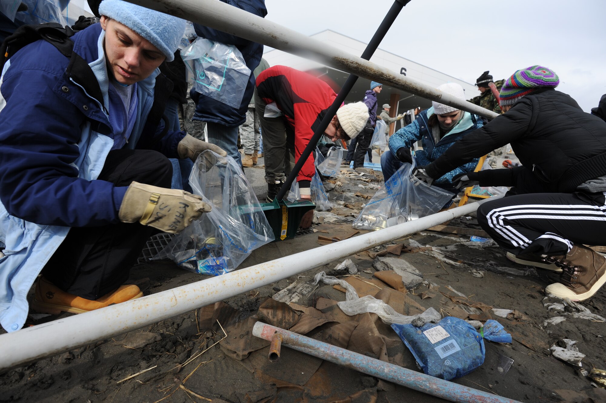 MISAWA AIR BASE, Japan - Residents of Misawa Air Base both civilian and military volunteer to help aid the Hachinohe recovery efforts March 17.  The 9.1 earth quake caused a massive tsunami to wash through the town of Hachinohe, Japan.  (U.S. Air Force Staff Sgt. April Quintanilla)