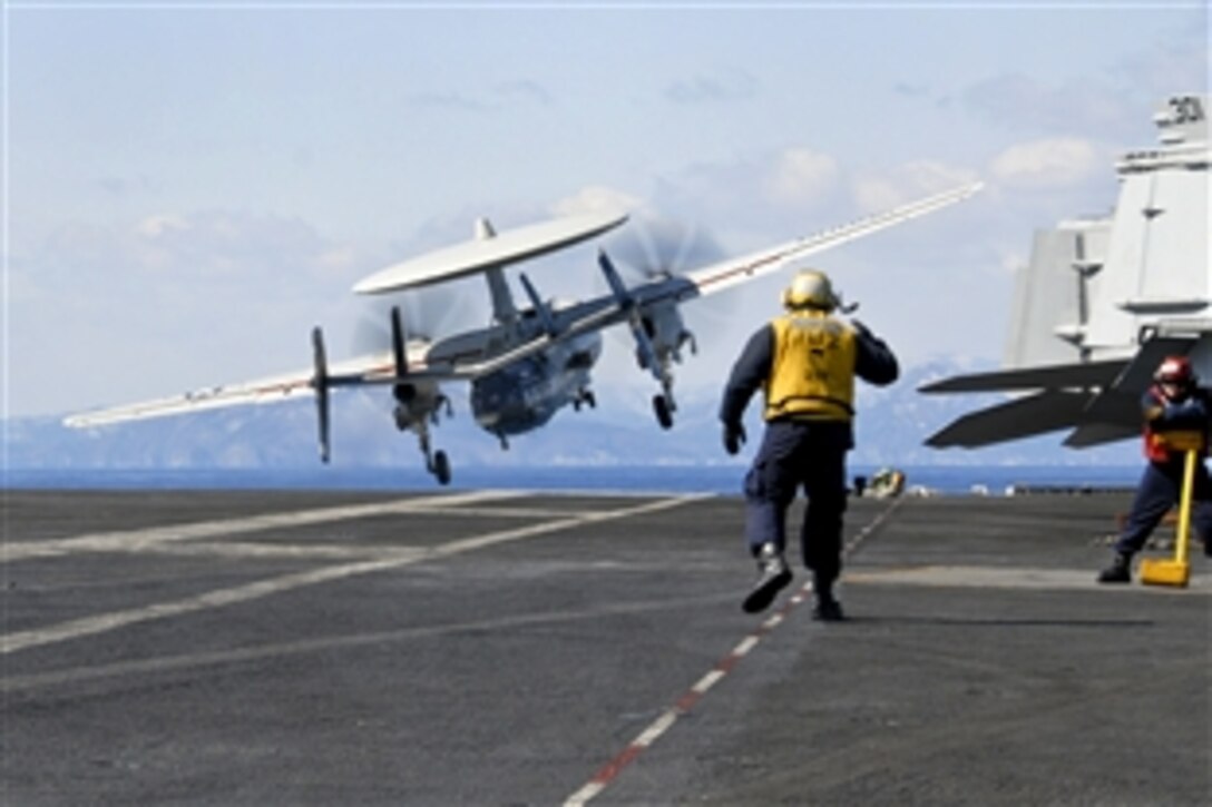 An E-2C Hawkeye 113 catapults off the flight deck of the aircraft carrier USS Ronald Reagan in the Pacific Ocean, March 18, 2011. The Hawkeye, assigned to Airborne Early Warning Squadron, provides aerial observation and damage assessment as well as air traffic coordination. The Ronald Reagan is off the coast of Japan providing humanitarian assistance to support Operation Tomodachi.