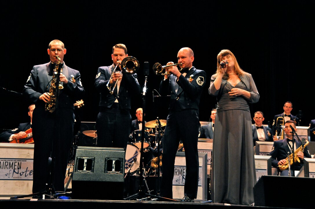 From left to right, Master Sgt. Douglas W. Morgan, baritone saxophonist, Tech. Sgt. Benjamin P. Patterson, trombonist, Master Sgt. Richard B. Sigler, trumpeter, and Tech. Sgt. Paige Martin, vocalist, members of the U.S. Air Force Band Airmen of Note perform an arrangement of Eric Clapton’s “Change the World” March 17 at Salem High School, Salem, Va. The Note is traveling through Virginia, Tennessee, Mississippi and Arkansas on it’s 2011 Spring Tour. (U.S. Air Force photo by Airman 1st Class Tabitha N. Haynes)