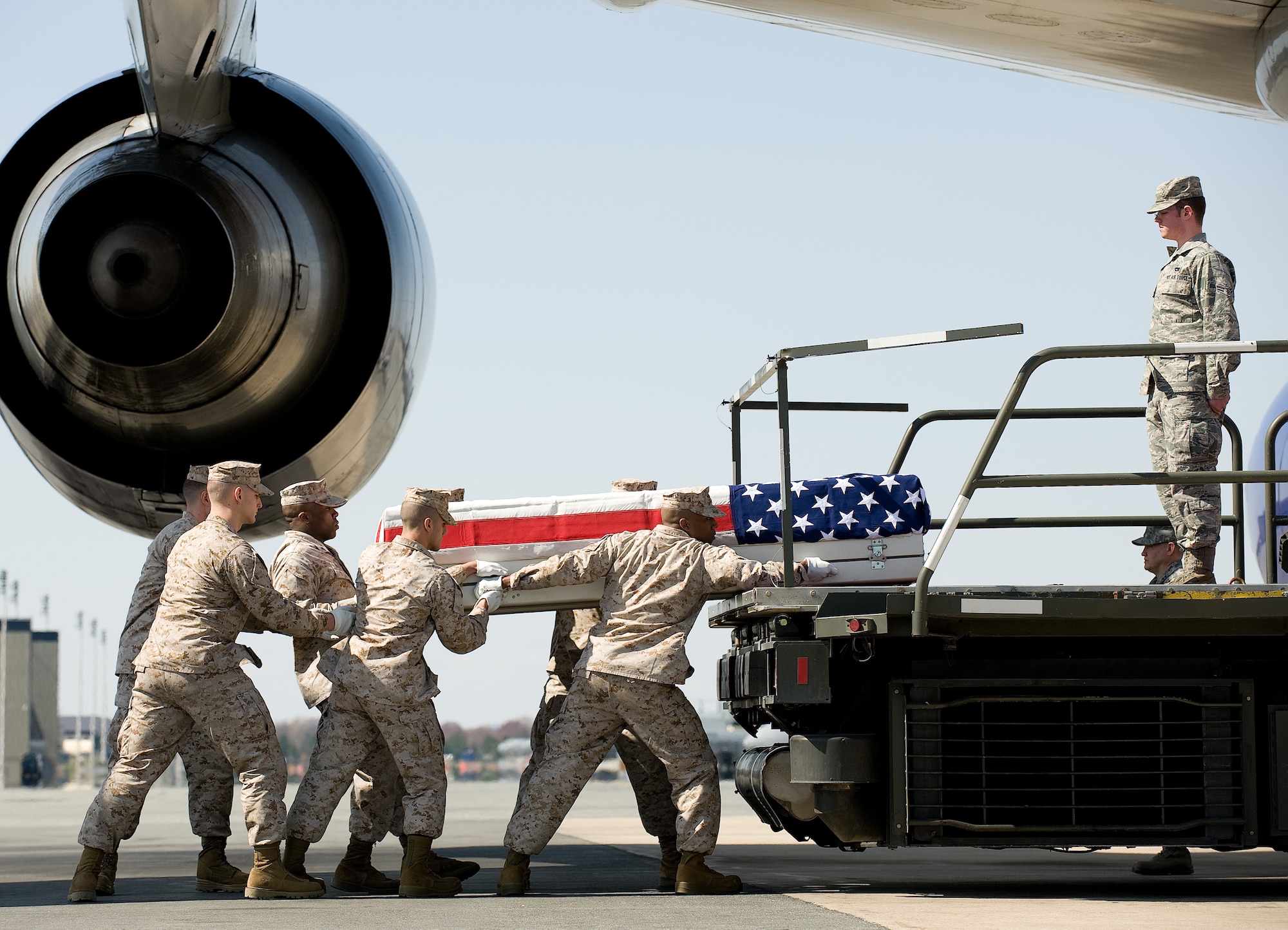 A U.S. Marine Corps carry team transfers the remains of Marine Lance Cpl. Christopher S. Meis of Bennett, Colo., at Dover Air Force Base, Del., March 19, 2011.  He was assigned to the 2nd Battalion, 8th Marine Regiment, 2nd Marine Division, II Marine Expeditionary Force, Camp Lejeune, N.C.  (U.S. Air Force photo/Jason Minto)