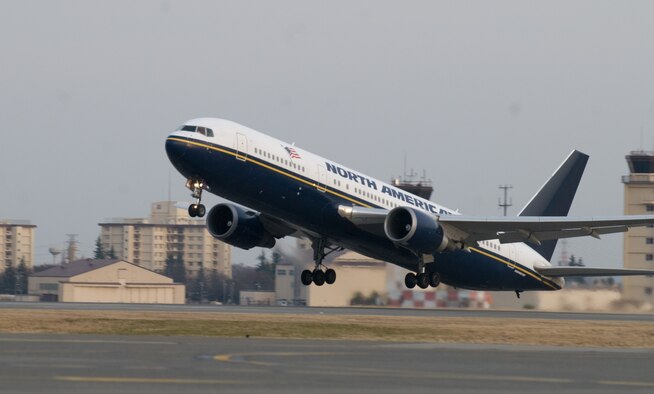 YOKOTA AIR BASE, Japan -- A Boeing-767 aircraft takes off here March 19. The 233 passengers onboard are part of the first voluntary authorized departure flight from Yokota. (U.S. Air Force photo/Staff Sgt. Robin Stanchak) 