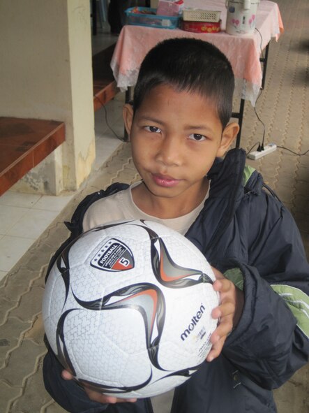 KORAT, Thailand - Worachai Buaban, nicknamed "Coke", holds a soccer ball donated by Airmen during a community outreach event to the Panyahukul Handicapped School in Korat, Thailand, March 18. The Airmen are participating in Exercise Cope Tiger 2011, an annual, multilateral, joint field training exercise currently being conducted at Korat and Udon Thani Royal Thai Air Bases March 14 through 25. (U.S. Air Force Photo/ Capt. Kirsten Udd)
