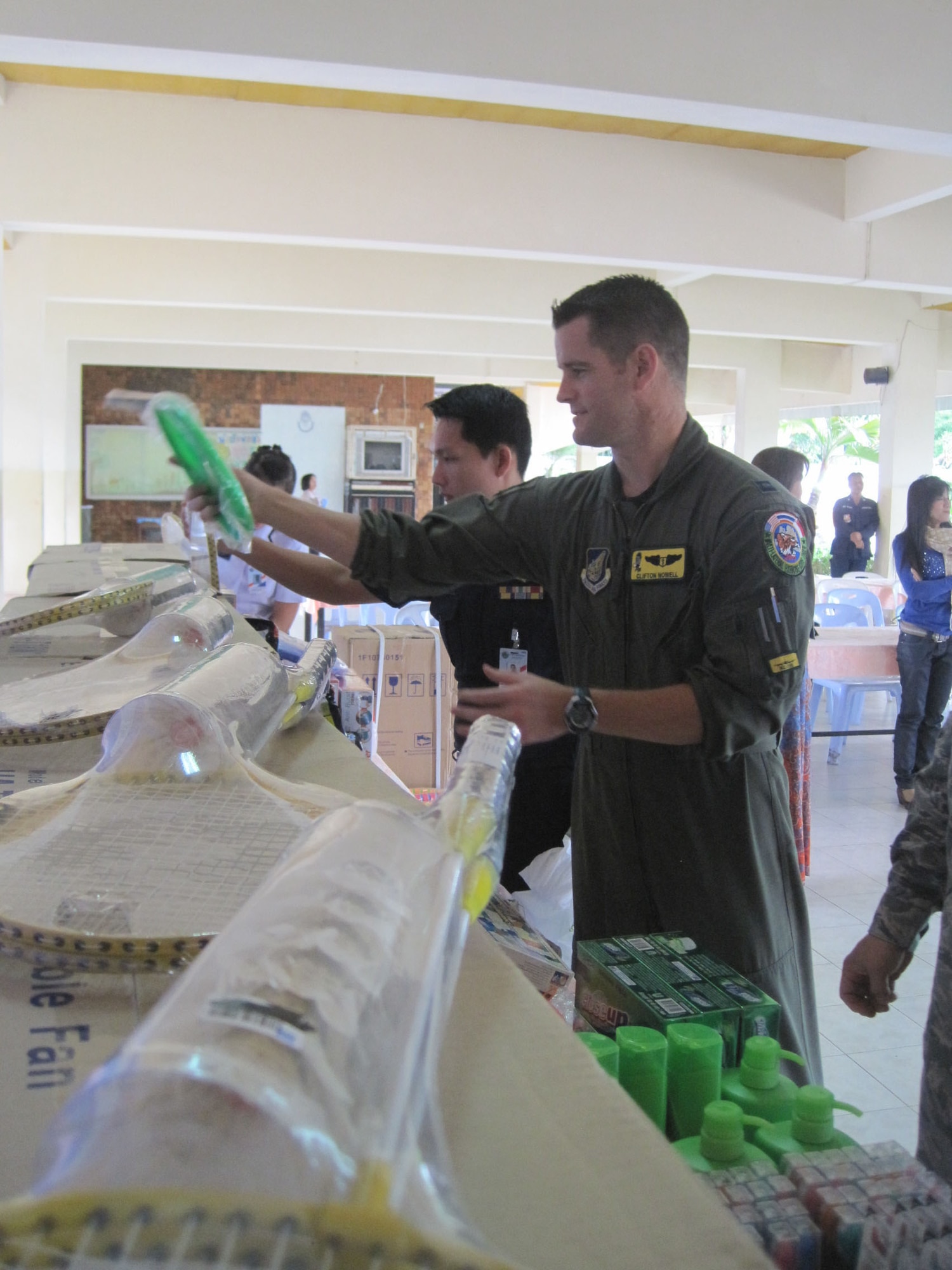 KORAT, Thailand - Airmen set up donations to the Panyahukul Handicapped School during a community outreach event in Korat, Thailand, March 18. The Airmen are participating in Exercise Cope Tiger 2011, an annual, multilateral, joint field training exercise currently being conducted at Korat and Udon Thani Royal Thai Air Bases March 14 through 25. (U.S. Air Force Photo/ Capt. Kirsten Udd)