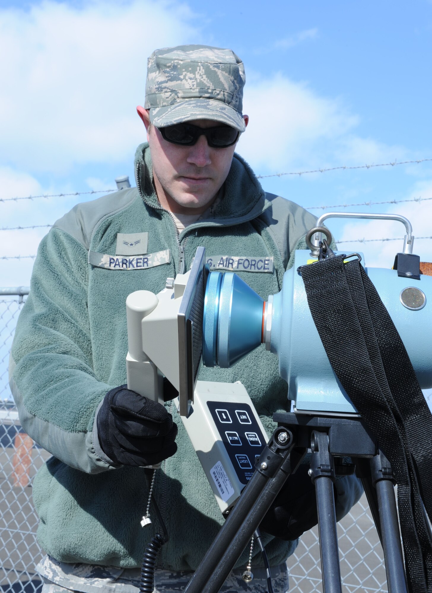 MISAWA AIR BASE, Japan–Airman First Class Dakota Parker, 35th Medical Group Bio-Environmental Engineer, uses an ADM
 300 meter to obtain readings off a high volume air sample Mar 18. Readings of the air quality are completed twice a day.
 (U.S. Air Force Tech. Sgt. Russell J. McBride\Released)

