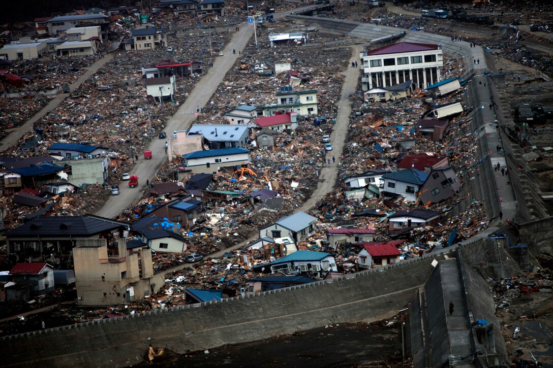 Damaged and destroyed houses and debris rest in a neighborhood area here. The remote area is one of many regions recently ravaged by the 9.0 earthquake and subsequent tsunami. The 31st Marine Expeditionary Unit delivered much needed relief supplies here, March 20. Navy and Marine Corps involvement is part of a larger U.S. government response, coordinated through the U.S. Department of State, after a 9.0 earthquake and subsequent tsunami struck Japan causing widespread damage. As part of Operation Tomodachi, the 31st MEU is ready to support our Japanese partners and to provide assistance when called upon.