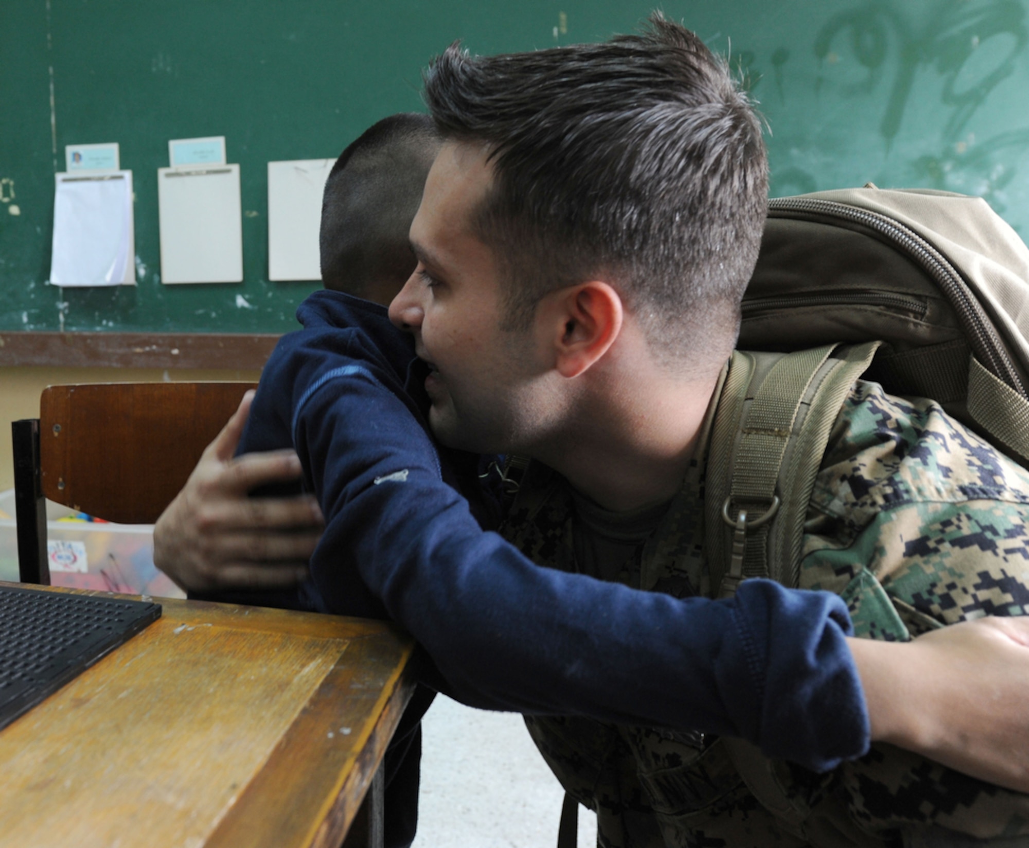 Hospital Corpsman Second Class Gabriel Fortes, a native of New Jersey by way of Brazil receives a hug of acknoledgement from  Darft, a young Thai student at the School for the Blind Education Service Center on March 18 in Korat, Thailand, during a break from Cope Tiger 2011,  an annual, multilateral, joint field training exercise currently being conducted at Korat and Udon Thani Royal Thai Air Bases March 14 through 25.  U.S. Sailors and Marines of the Marine All-Weather Fighter Attack Squadron 533, Marine Corps Air Station Iwakuni, Japan took time from the exercise to visit the school. Participants of Cope Tiger include the U.S. Air Force, the U.S. Marine Corps, the Royal Thai Air Force, Royal Thai Army, and the Republic of Singapore Air Force.  (U.S.  Air Force photo/Master Sgt. Cohen A. Young)