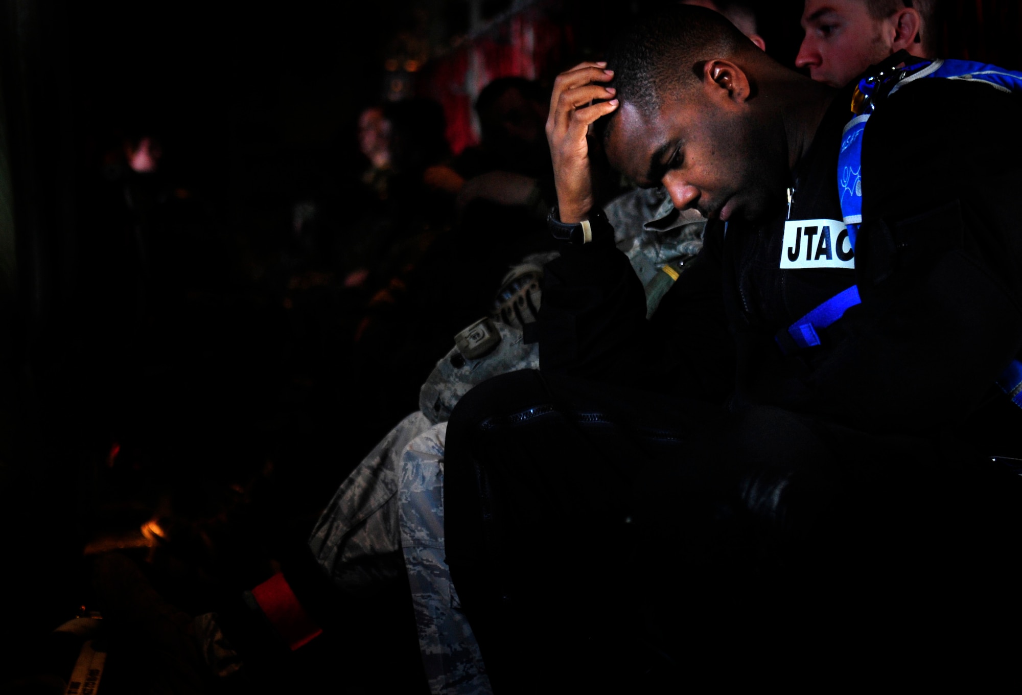 U.S. Air Force Master Sgt. Robert Zackery, 4th Air Support Operations Group, military free fall jump master, prepares for a high altitude, low open jump with U.S. and Romanian paratroopers over a landing zone near Campia Turzii, Romania, March 18, 2011.  This jump was conducted as a part of Carpathian Spring 2011, a building partnership capacity exercise where members of U.S. military joined their Romanian counterparts to learn from one another and strengthen alliances. (U.S. Air Force Photo by Tech Sgt. Jocelyn L. Rich)(released)