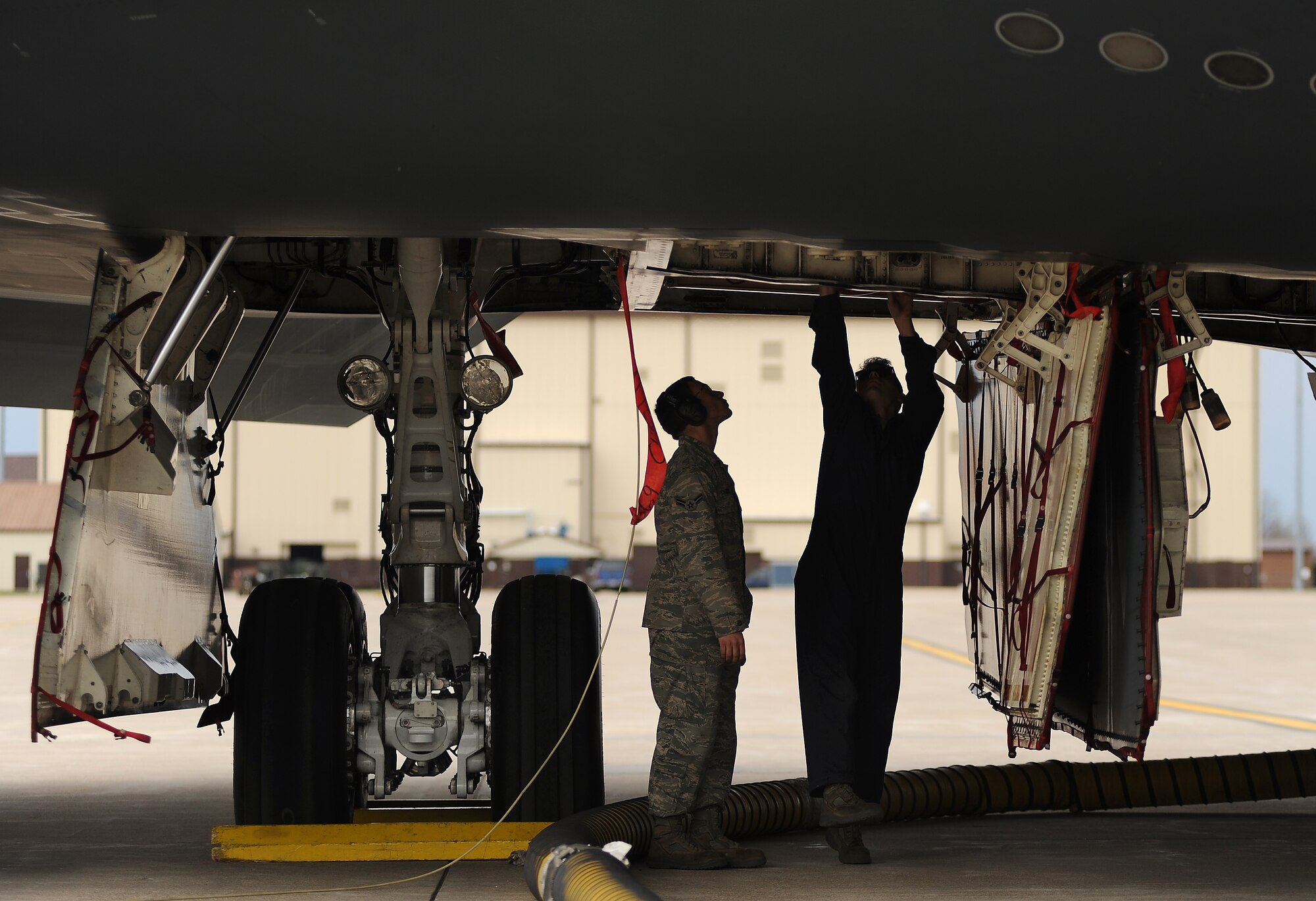 WHITEMAN AIR FORCE BASE Mo. 509th Aircraft Maintenance Squadron, maintainers and crew chiefs, prepare B-2 Stealth Bombers for Operation Odyssey Dawn March 19, 2011. (U.S. Air Force photo by Senior Airman Kenny Holston)(Released)

