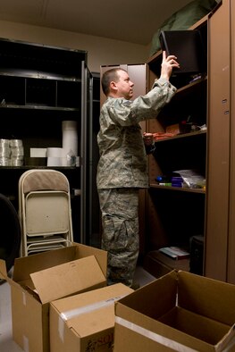 JOINT BASE ELMENDORF-RICHARDSON, Alaska -- Master Sgt. Jack Parks, a member of the 176th Logistics Readiness Squadron's Traffic Management Office, stocks office supplies in cabinets here March 19, 2011. The squadron recently moved (along with its parent unit, the 176th Wing) from Kulis Air National Guard Base to Joint Base Elmendorf-Richardson per the 2005 Defense Base Realignment and Closure proposal. Alasa Air National Guard photo by Master Sgt. Shannon Oleson.