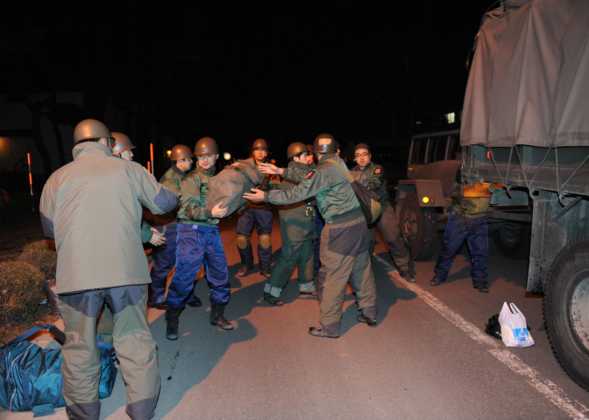 MISAWA AIR BASE, Japan– A disaster relief team from the Japan Air Self-Defense Force return Mar. 19. The team unloads personal gear, equipment and supplies used during their relief work in Yamada, Japan. (U.S. Air Force Photo/Tech. Sgt. Russell J. McBride)
