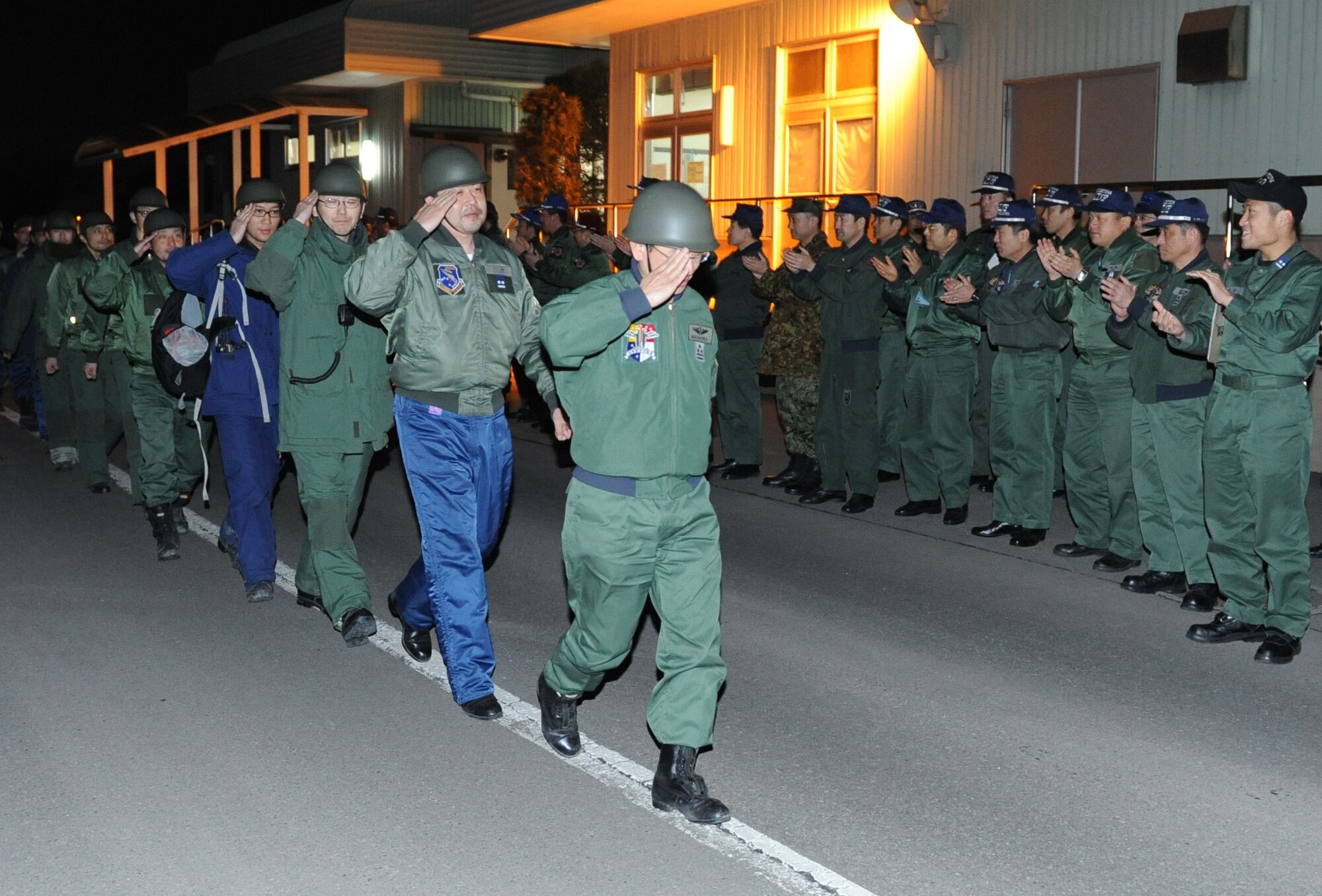 MISAWA AIR BASE, Japan– A disaster relief team consisting of members of the Japan Air Self-Defense Force, return Mar. 19.The team was welcomed back by their coworkers and friends.  (U.S. Air Force Photo/Tech. Sgt. Russell J. McBride)