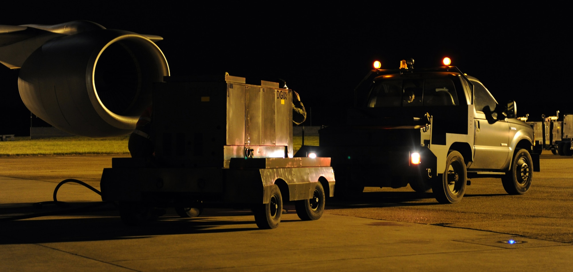 RAF MILDENHALL, England -- Members of the 100th Aircraft Maintenance Squadron remove a power cart to allow a KC-135 Stratotanker to taxi for a refueling mission in support of Joint Task Force Odyssey Dawn. JTF Odyssey Dawn is the U.S. Africa Command task force established to provide operational and tactical command and control of U.S. military forces supporting the international response to the unrest in Libya and enforcement of United Nations Security Council Resolution (UNSCR) 1973. UNSCR 1973 authorizes "all necessary measures" to protect civilians in Libya under threat of attack by Gadhafi regime forces. JTF Odyssey Dawn is commanded by U.S. Navy Admiral Sam Locklear. (U.S. Air Force photo by Senior Airman Tabitha M. Lee)