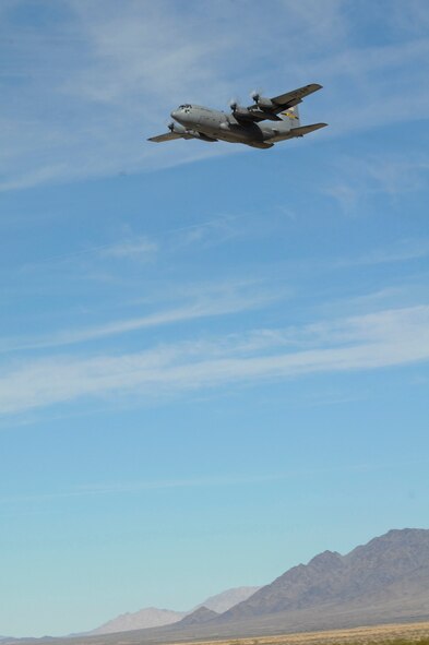 A lone 133rd Airlift Wing C-130 Hercules flies over the desert mountains of a California drop zone on its drop approach Feb. 28, 2011. During the week of Feb. 28th, 2011 Airmen and the C-130 Hercules of the 133rd Airlift Wing, Minnesota Air National Guard deployed for training to Yuma Proving Ground, Yuma, Ariz. . During the week the 133rd AW practiced Low-Cost Low-Altitude airdrops this knowledge and experience will be directly applied during deployment to Afghanistan. The LCLA bundles are more accurate and use expendable parachutes weighing in at 80 to 500 pounds. LCLA is well suited for small units on patrol or in remote outposts where they don't have the equipment or manpower to deal with the larger container delivery system bundles. U.S. Air Force photo by Tech. Sgt. Erik Gudmundson