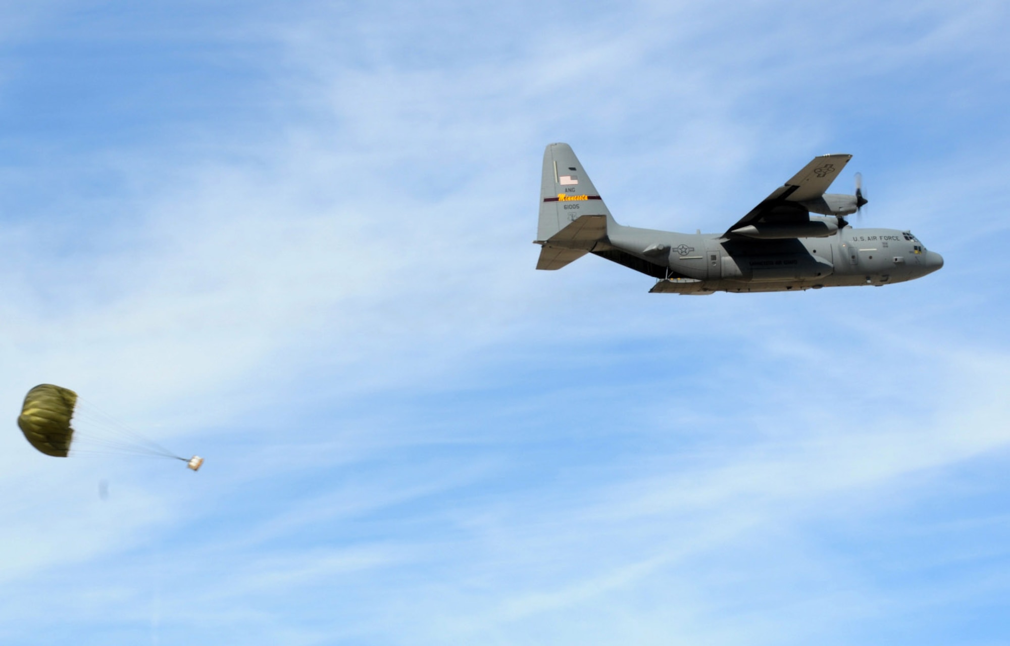 A Low Cost Low Altitude bundle falls to the ground under a full parachute canopy after release from a 133rd Airlift Wing Minnesota Air National Guard C-130 Hercules Feb. 28, 2011. During the week of Feb. 28th, 2011 Airmen and the C-130 Hercules of the 133rd Airlift Wing, Minnesota Air National Guard deployed for training to Yuma Proving Ground, Yuma, Ariz.  During the week the 133rd AW practiced Low-Cost Low-Altitude airdrops this knowledge and experience will be directly applied during deployment to Afghanistan. The LCLA bundles are more accurate and use expendable parachutes weighing in at 80 to 500 pounds. LCLA is well suited for small units on patrol or in remote outposts where they don't have the equipment or manpower to deal with the larger container delivery system bundles. U.S. Air Force photo by Tech. Sgt. Erik Gudmundson