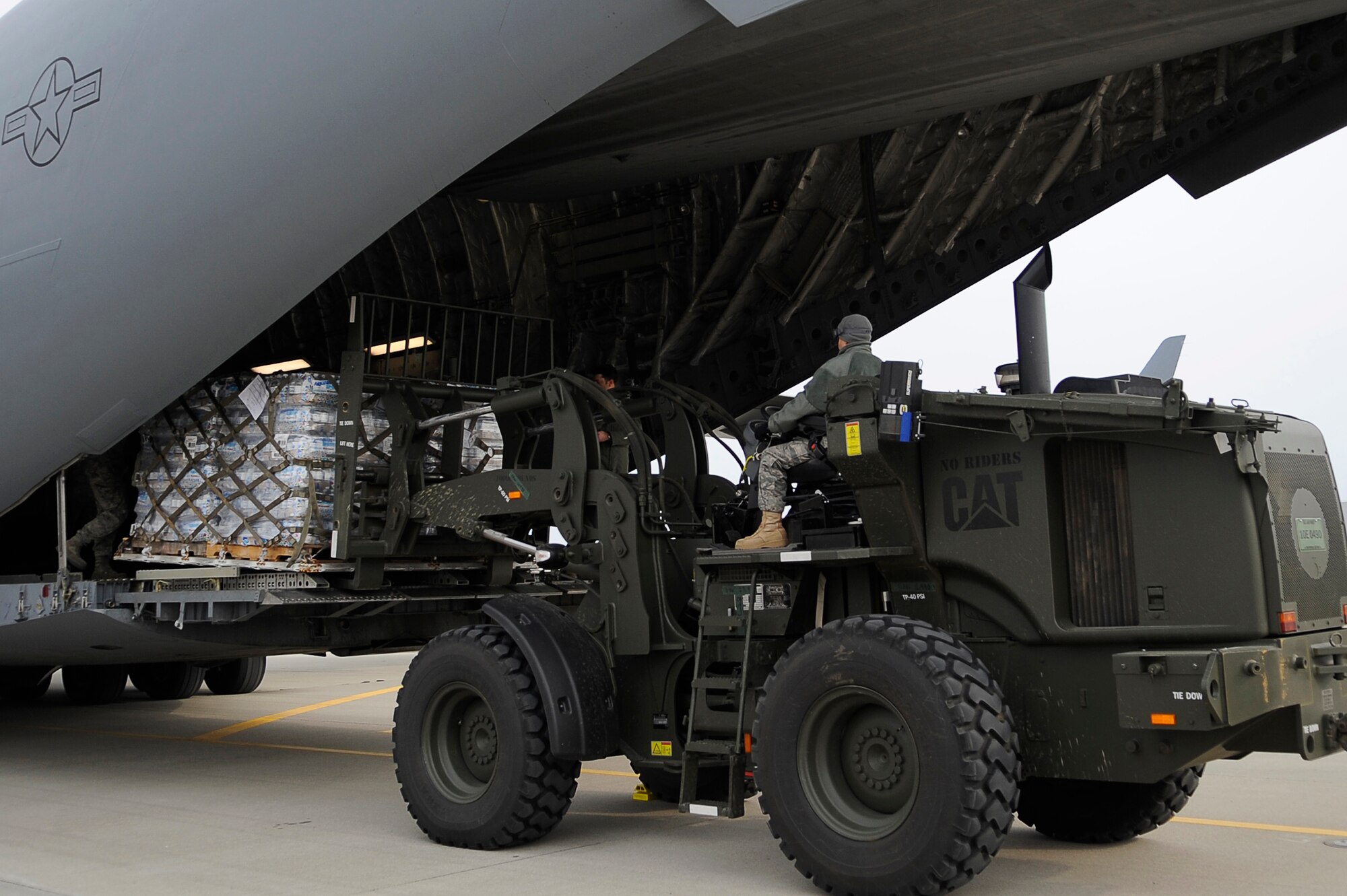 SENDAI AIRPORT, Japan -- Humanitarian supplies are unloaded from a C-17 Globemaster III here March 20. The 517th Airlift Squadron, Joint Base Elemendorf/Richardson flew the first C-17 mission to Sendai in support of Operation Tomodachi. (U.S. Air Force photo by/ Master Sgt. Jeromy K. Cross/Released)









