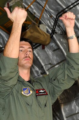 Master Sgt. Stephen Mallory, C-17 Globemaster III loadmaster from the 517th Airlift Squadron at Joint Base Elemendorf-Richardson, Alaska, directs the unloading of humanitarian supplies at Sendai Airport, Japan, on March 20, 2011, in support of Operation Tomodachi. Sergeant Mallory and crew members from the 517th AS flew the first C-17 mission to Sendai Airport following the 8.9-magnitude earthquake and subsequent tsunami that struck the area March 11, 2011 (U.S. Air Force Photo/Master Sgt. Jeromy K. Cross)