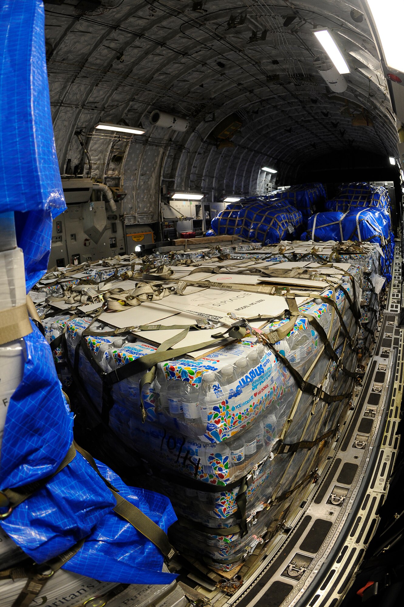 YOKOTA AIR BASE, Japan -- Humanitarian supplies are transported on a C-17 Globemaster III aircraft from Yokota to Sendai Airport  March 20. The 517th Airlift Squadron, Joint Base Elemendorf/Richardson operated the first C-17 into Sendai Airport in support of Operation Tomodachi. (U.S. Air Force photo by/ Master Sgt. Jeromy K. Cross/Released)









