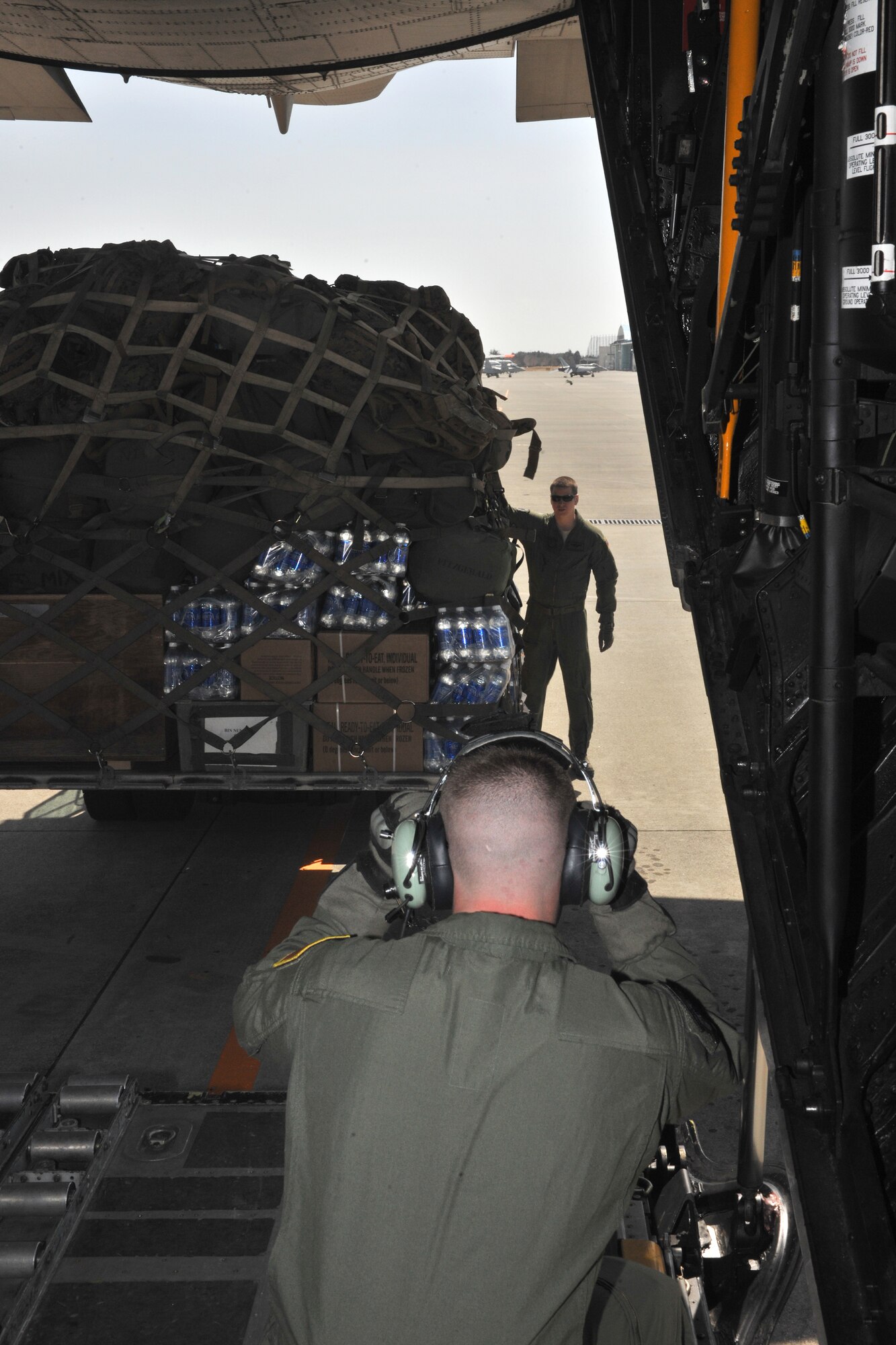 YOKOTA AIR BASE, Japan -- Senior Airman J.T. Mills (near), and Staff Sgt. Nick Wisnoski, 17th Special Operations Squadron, Kadena Air Base, Japan, load a pallet on a MC-130 at Marine Corps Air Station Iwakuni, Japan, March 19. The 17th SOS was at MCAS Iwakuni to transport Marines in support of Operation Tomodachi. (U.S. Air Force photo/Master Sgt. Jeromy K. Cross)









