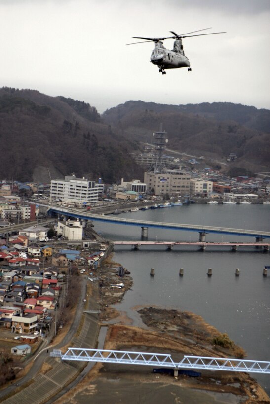 A CH-46E Sea Knight helicopter with Marine Medium Helicopter Squadron 262 (Reinforced), 31st Marine Expeditionary Unit, flies over Miyako, Japan March, 21. The helicopter was carrying water and blankets to aid those affected by the 9.0 earthquake and subsequent tsunami that ravaged the region. Navy and Marine Corps involvement in the relief mission is part of a larger U.S. government response, coordinated through the U.S. Department of State, aiding the government of Japan in their ongoing relief efforts. As part of Operation Tomodachi, the 31st MEU is ready to support our long-time Japanese partners and to provide assistance when called upon.