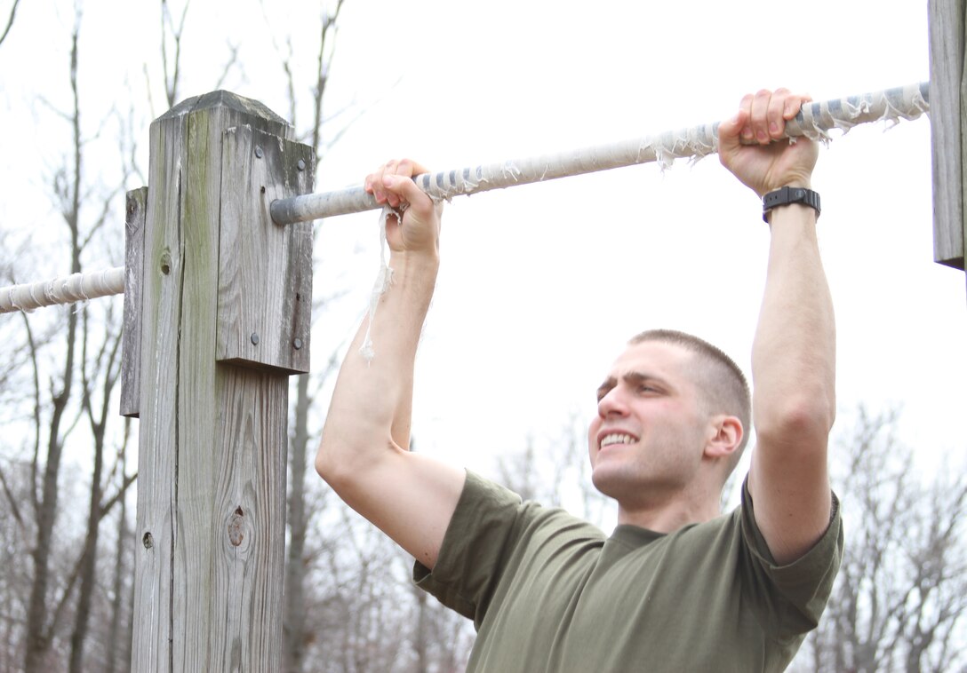 Second Lt. Andrew Fink, assistant student judge advocate, Marine Corps Recruiting Command, does pull ups to prepare himself for MCRC’s upcoming physical fitness test as well as The Basic School, where he will go in June. By working at MCRC while waiting to be admitted to the bar, Fink has gotten a preview of active duty outside of TBS.