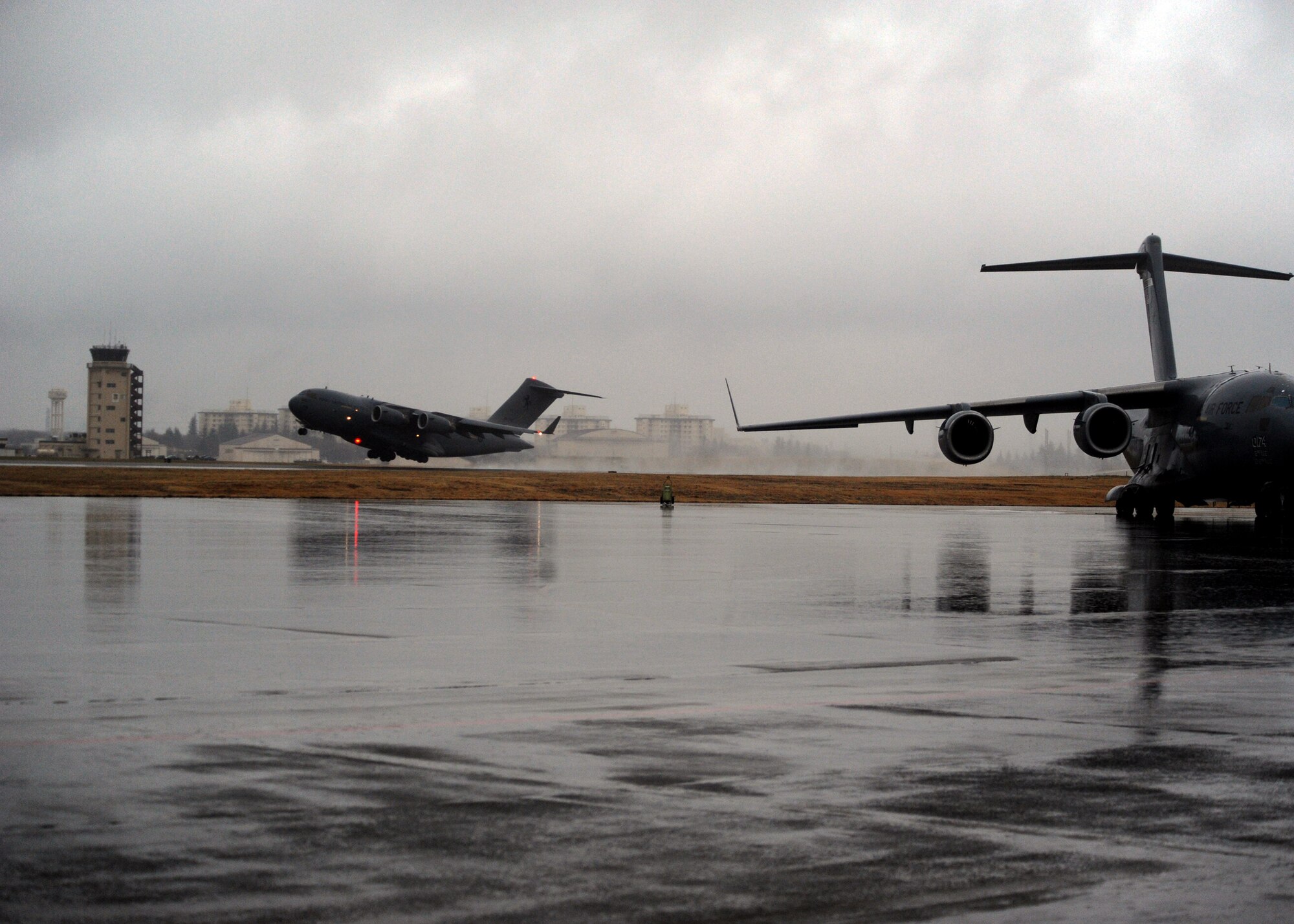 YOKOTA AIR BASE, Japan -- A C-17 Globemaster III from Royal Australian Air Force Base Amberley takes off carrying 16 pallets of humanitarian aid to Sendai, Japan, March 21. With the assistance of Yokota Airmen, the RAAF were able to deliver 90,000 pounds of cargo in support of Operation Tomodachi. Operation Tomodachi is a relief support mission aiding those affected by the devastation caused by the recent earthquake and tsunami March 11. (U.S. Air Force photo/Senior Airman Michael J. Veloz) 