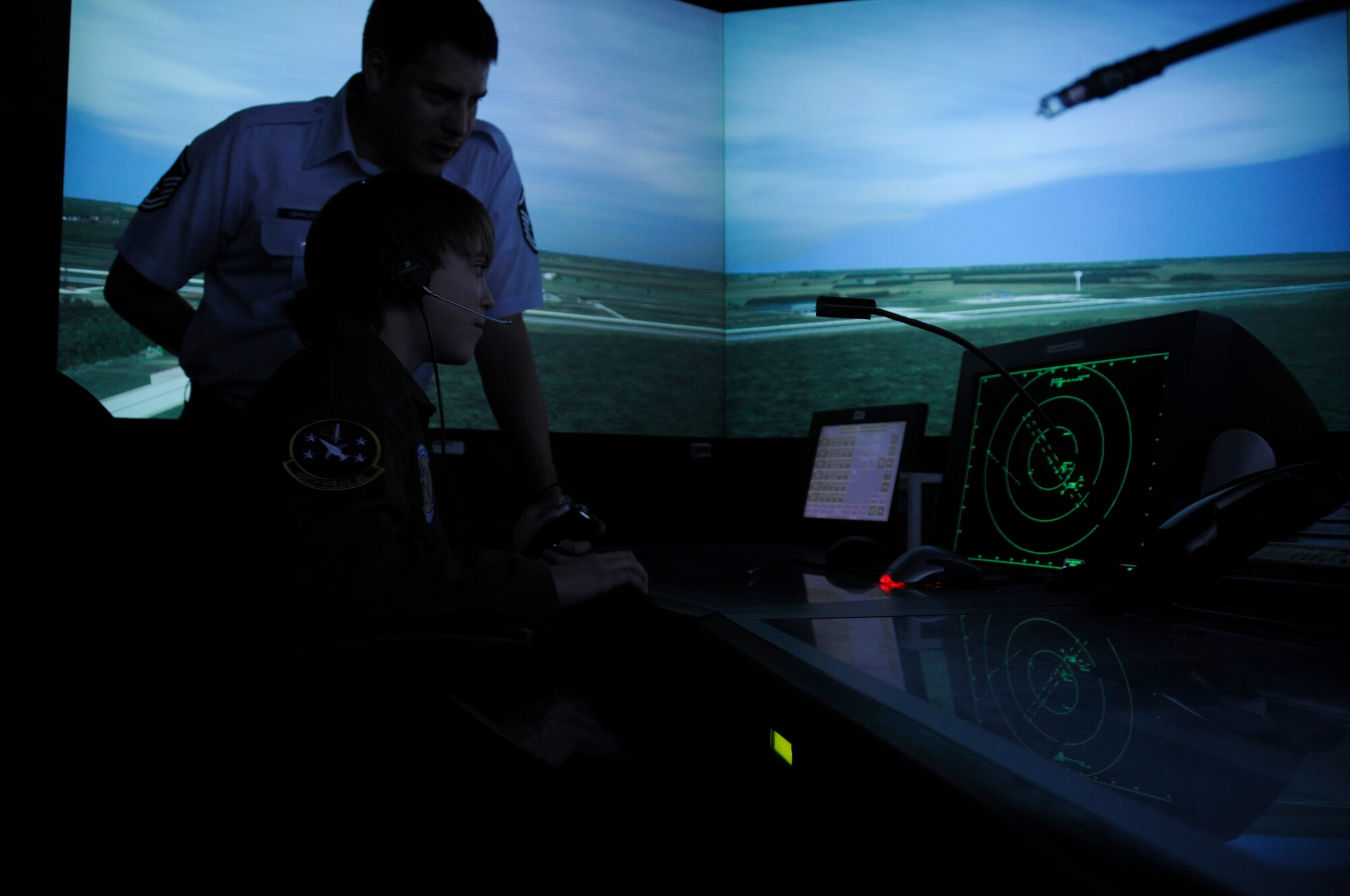 Hunter Bozaich uses the Air Traffic Control simulator during his visit for the Pilot for a Day program, March 21, 2011 at Scott Air Force Base, Ill. Hunter, who is diagnosed with Cystic Fibrosis was nominated by Cardinal Glennon Children's Medical Center to come to Scott and be a pilot for a day. His day consisted of multiple events and tours to include a C-40 Static, a military working dog demonstration, tower tour, and a ride in a flight simulator. (U.S. Air Force photo/Staff Sgt. Brian J. Valencia)