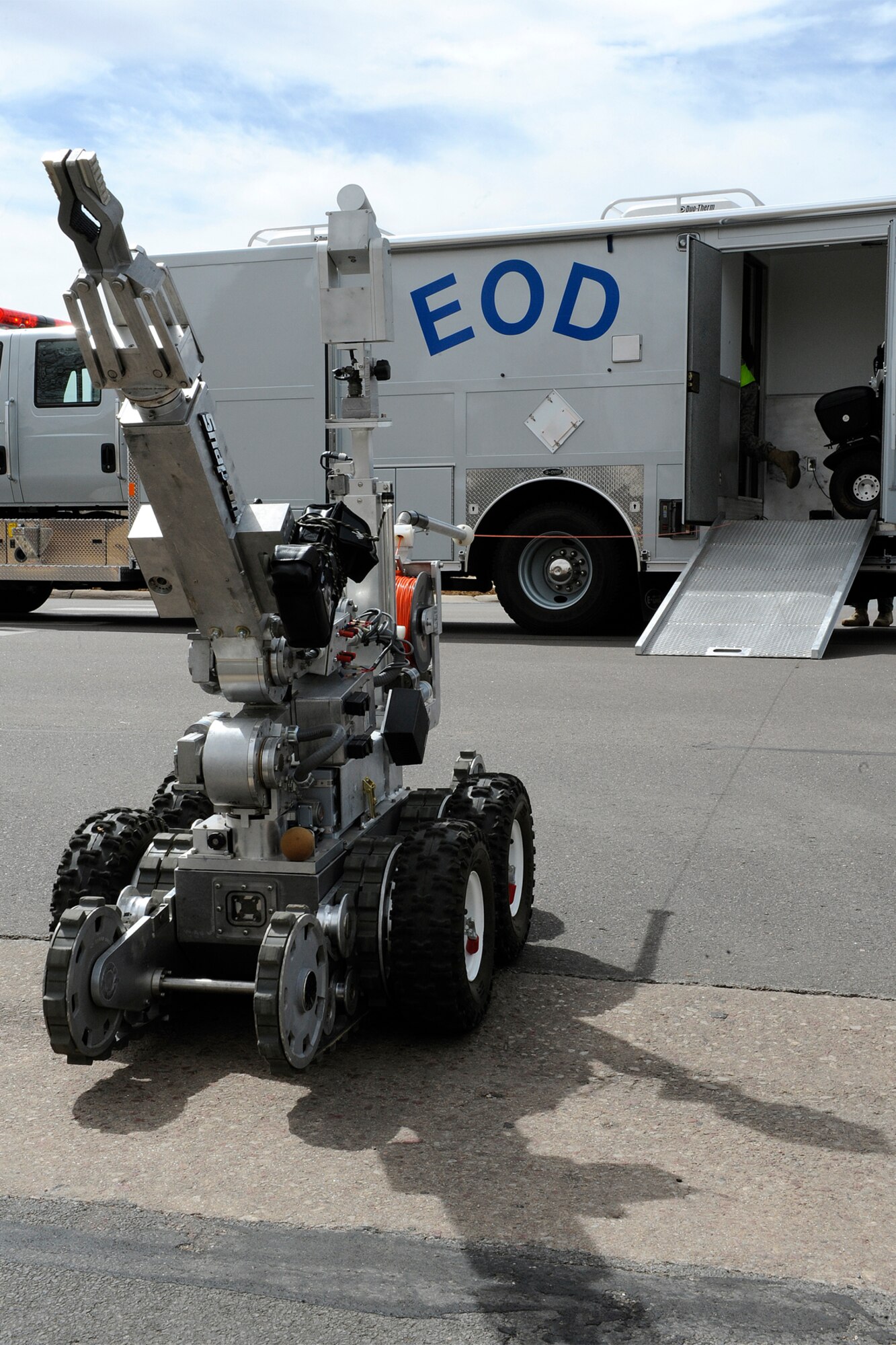 An explosive ordnance disposal robot from the 21st Civil Engineer Squadron’s EOD shop is dispatched to examine a suspicious package after a simulated explosion in the base auditorium during an emergency management exercise March 15. The EME was part of the wing’s Operational Readiness Inspection and Unit Compliance Inspection, which started Feb. 28 and concluded March 21. (U.S. Air Force photo/Craig Denton)