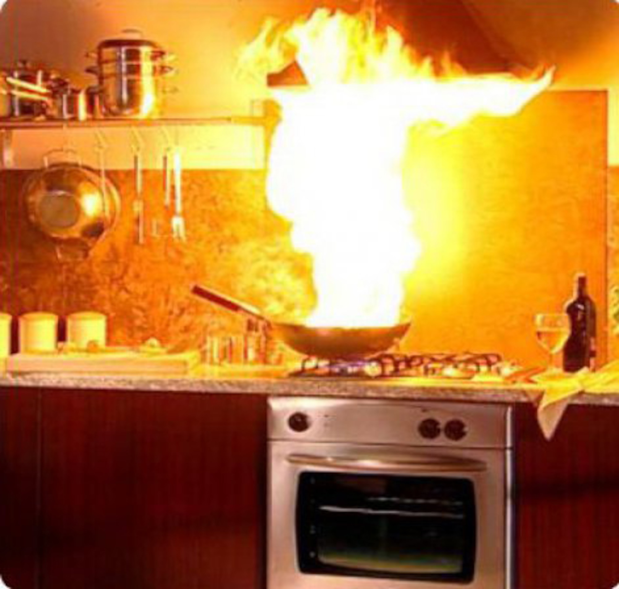 A fire blazes in a pan on a stove. (Courtesy photo)