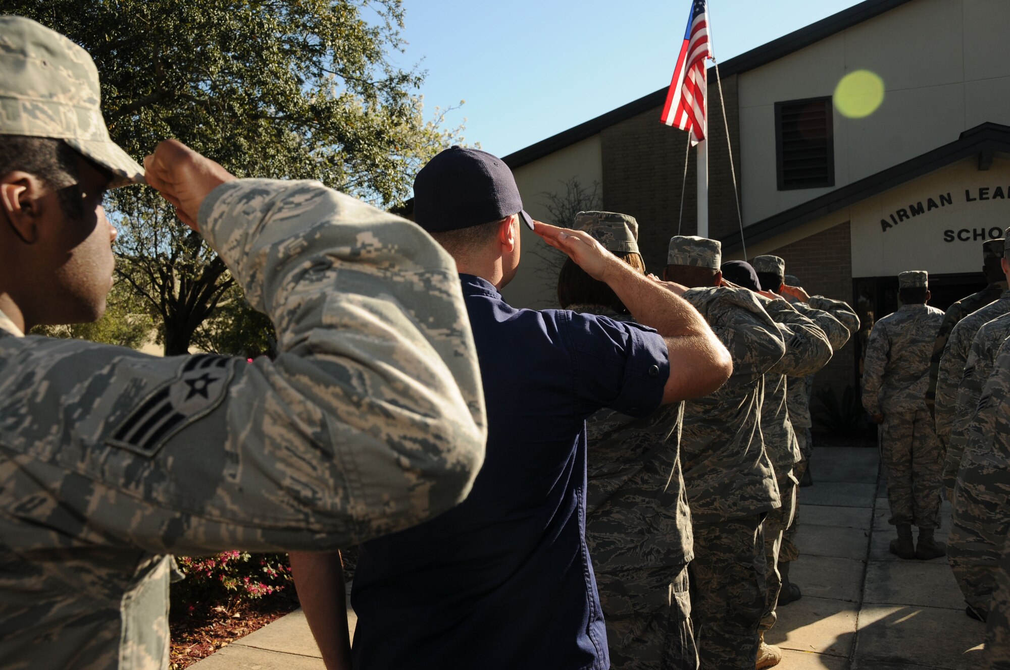 Coast Guard Petty Officer 3rd Class Brandon Castelloe stand in formation with fellow ALS classmates during Friday’s retreat. He’s assigned to USCGC Shamal which is
homeported in Pascagoula, Miss.  (U.S. Air Force photo by Kemberly Groue)
