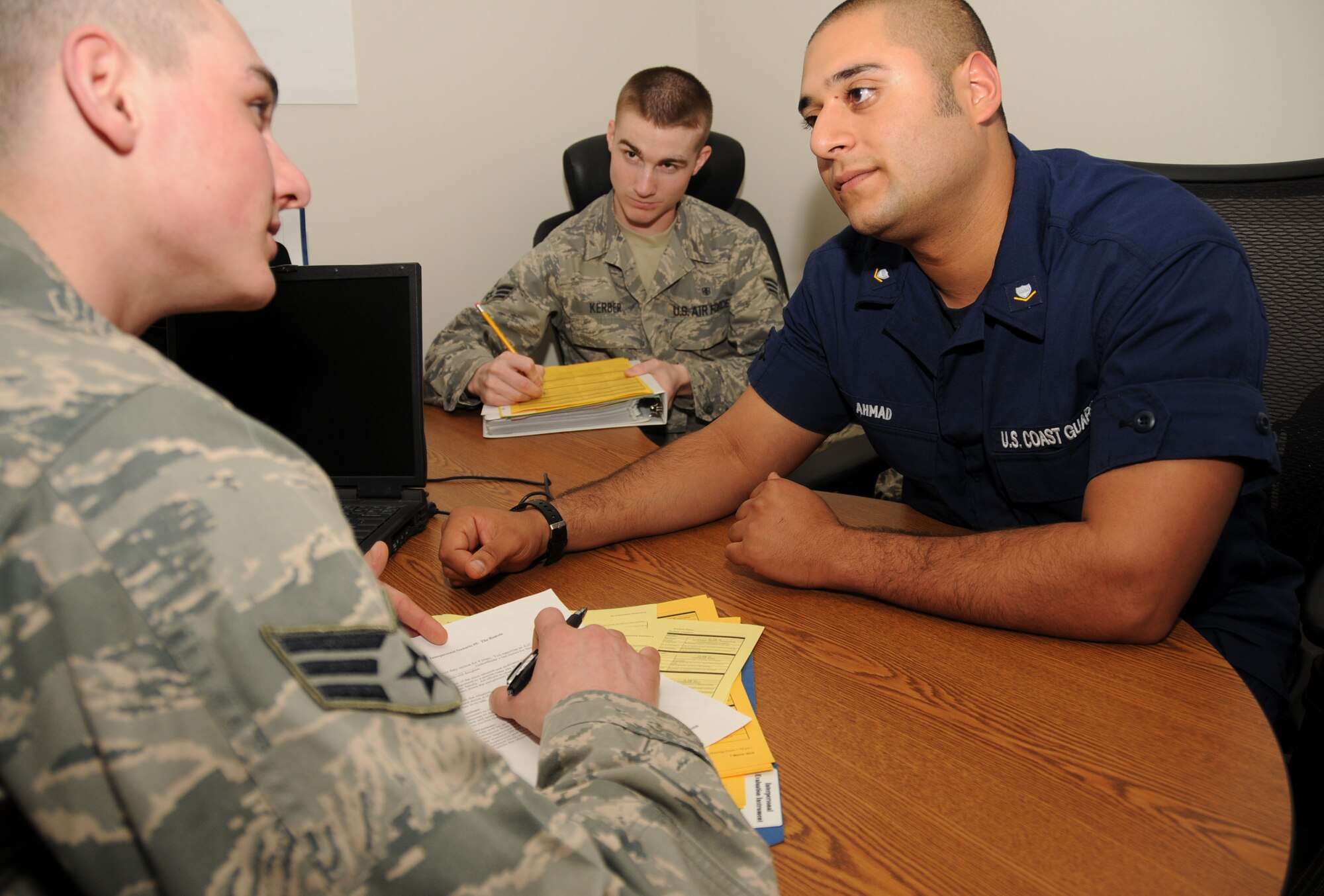 From left, Senior Airmen Nicholas Babian, left, 81st Diagnostics and Therapeutics Squadron, and Mike Kerber, 81st Surgical Operations Squadron, participate in an interpersonal counseling exercise with Coast Guard Petty Officer 3rd Class Shoja Ahmad during an Airman Leadership School class Friday. Airman Babian portrays a supervisor counseling a troubled student, portrayed by Petty Officer Ahmad, while Airman Kerber is an observer. Petty Officer Ahmad is assigned to USCGC Shamal which is homeported in Pascagoula, Miss.  (U.S. Air Force photo by Kemberly Groue)