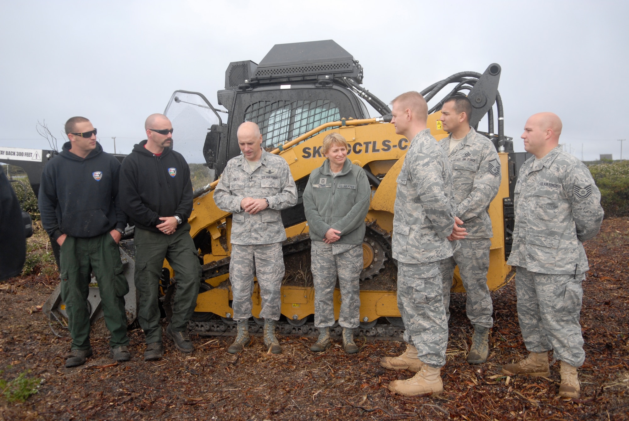 VANDENBERG AIR FORCE BASE, Calif. - Members of the Vandenberg Hot Shots, 30th Space Wing leadership, 30th Medical Group and Airfield Operations Flight gather in front of The Masticator here Wednesday, March 16, 2011. (U.S. Air Force photo/1st Lt. Ann Blodzinski)
