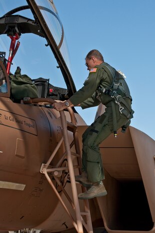NELLIS AIR FORCE BASE, Nev. -- Gen. William M. Fraser III, commander of Air Combat Command, climbs into a 65th Aggressor Squadron F-15 Eagle for a training mission during Red Flag 11-3, March 9. During his weeklong visit here, General Fraser also flew on an E-3 Sentry Airborne Warning and Control System aircraft. (U.S. Air Force photo/Tech. Sgt. Michael R. Holzworth)