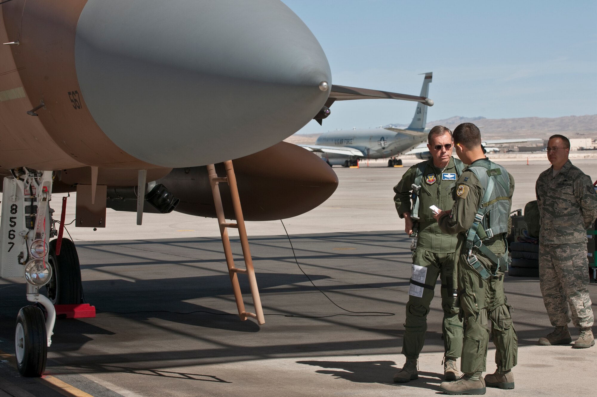 NELLIS AIR FORCE BASE, Nev. -- Gen. William M. Fraser III, commander of Air Combat Command, and Capt. Joshua Fogle, 65th Aggressor Squadron pilot, prepare for a training mission in a F-15 Eagle during Red Flag 11-3, March 9. During his weeklong visit here, General Fraser also flew on an E-3 Sentry Airborne Warning and Control System aircraft. (U.S. Air Force photo/Tech. Sgt. Michael R. Holzworth)

