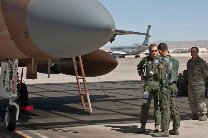 NELLIS AIR FORCE BASE, Nev. -- Gen. William M. Fraser III, commander of Air Combat Command, and Capt. Joshua Fogle, 65th Aggressor Squadron pilot, prepare for a training mission in a F-15 Eagle during Red Flag 11-3, March 9. During his weeklong visit here, General Fraser also flew on an E-3 Sentry Airborne Warning and Control System aircraft. (U.S. Air Force photo/Tech. Sgt. Michael R. Holzworth)