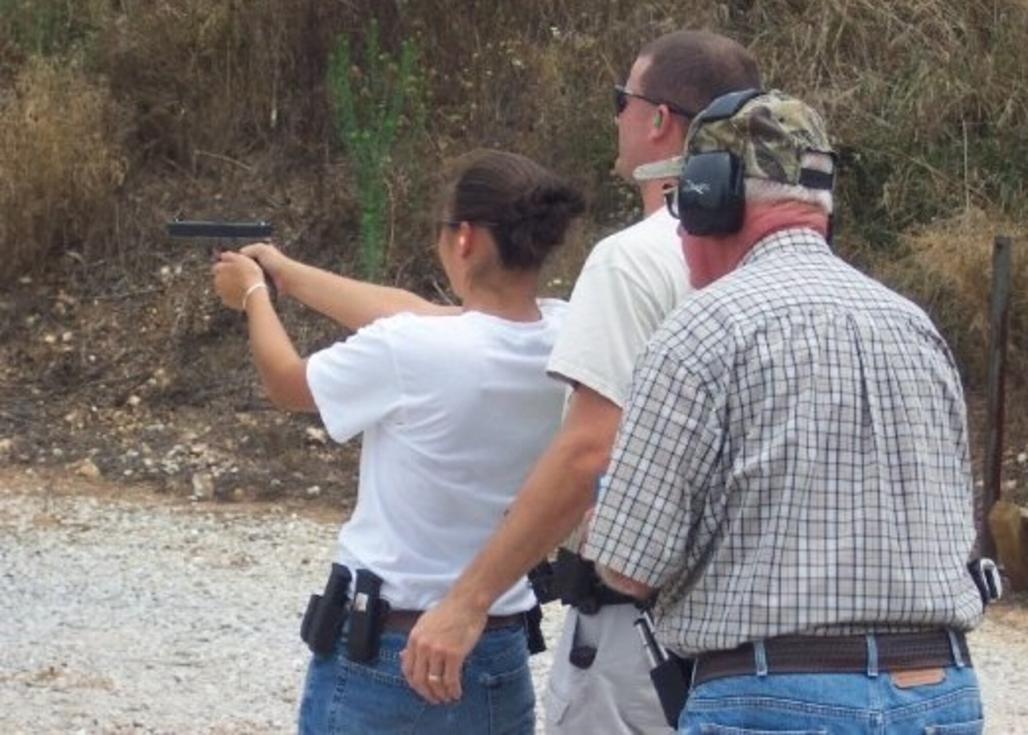 HARRISON, Ark.-- A young Airman 1st Class Meghan Hilton, 822nd Base Defense Squadron member, shoots at a range in Harrison, Ark., in 2005. She is now certified on the .50-caliber machine gun, Mark 19 grenade launcher and 203 mm grenade launcher. (Contributed photo) (RELEASED)