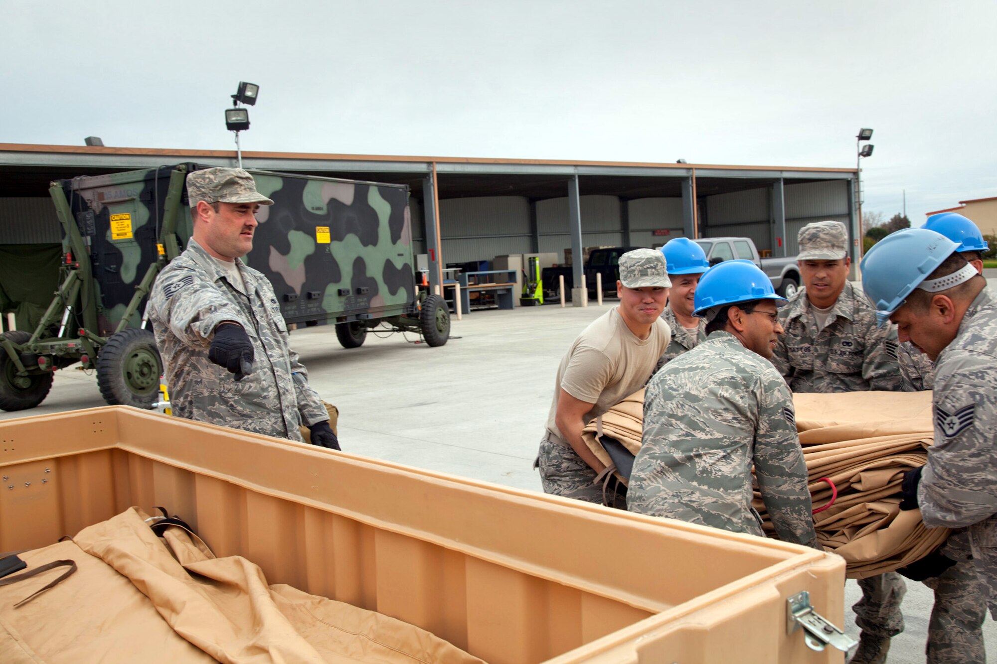 Members of the 23rd Combat Communications Squadron pack equipment after a deployment and skills-training exercise on Travis Air Force Base, March 13, 2011.  (U.S. Air Force photo / Lt. Col. Robert Couse-Baker)

